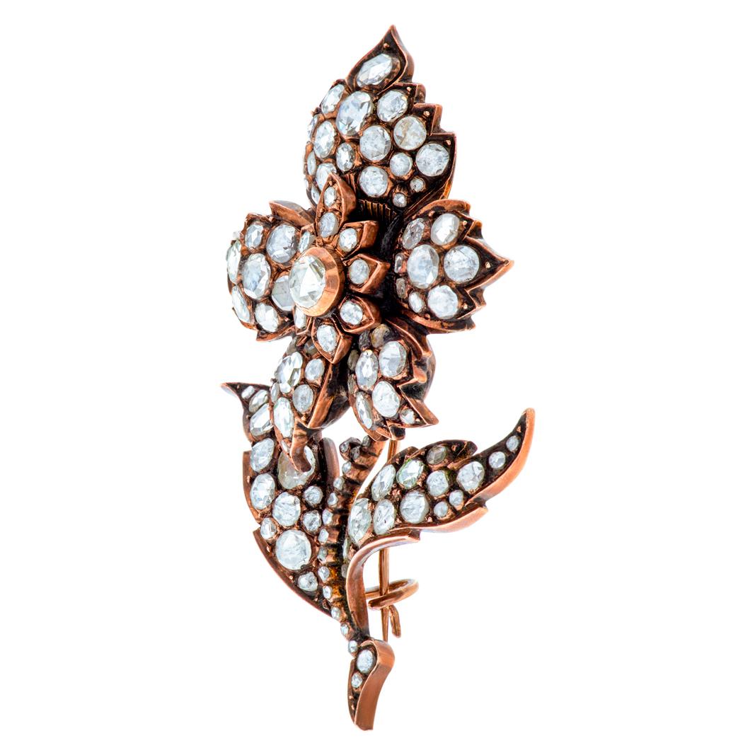 ESTIMATED RETAIL $10,200.00 - YOUR PRICE $5,100.00 - Victorian flower brooch in silver top over 14K rose gold with over 4 carats in rose cut diamonds. Brooch is in original condition. A beautiful heirloom piece. Measurements: 2.5'' x 1.25''.