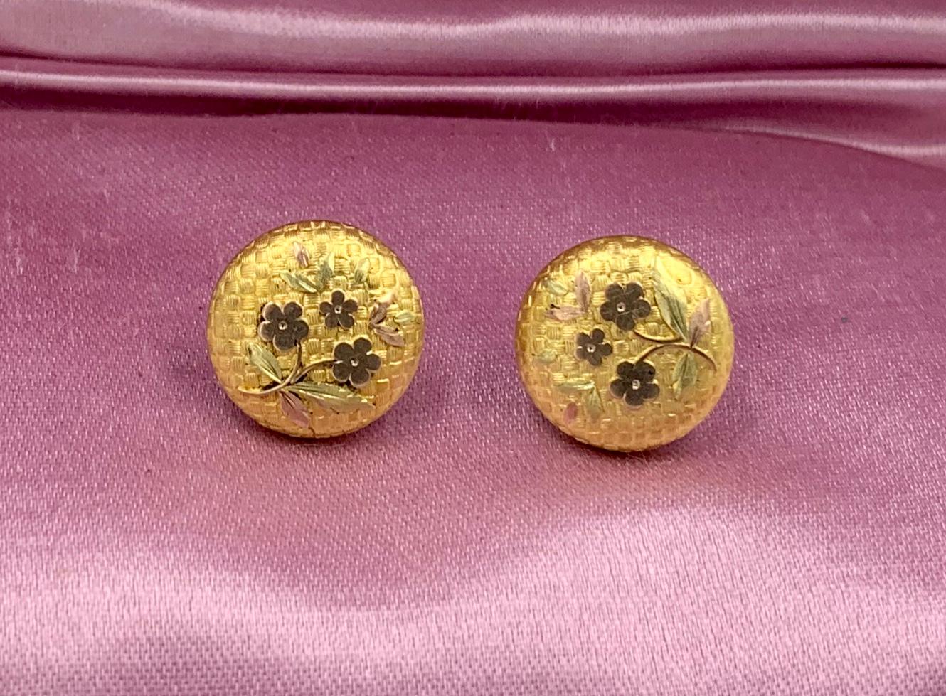 This is a rare pair of Etruscan Revival Victorian Flower Motif Earrings in 10 Karat Gold.  The exquisite earrings have an engraved checkerboard background with a flower and leaf motif.   The gold work is stunning and the warm color of the antique