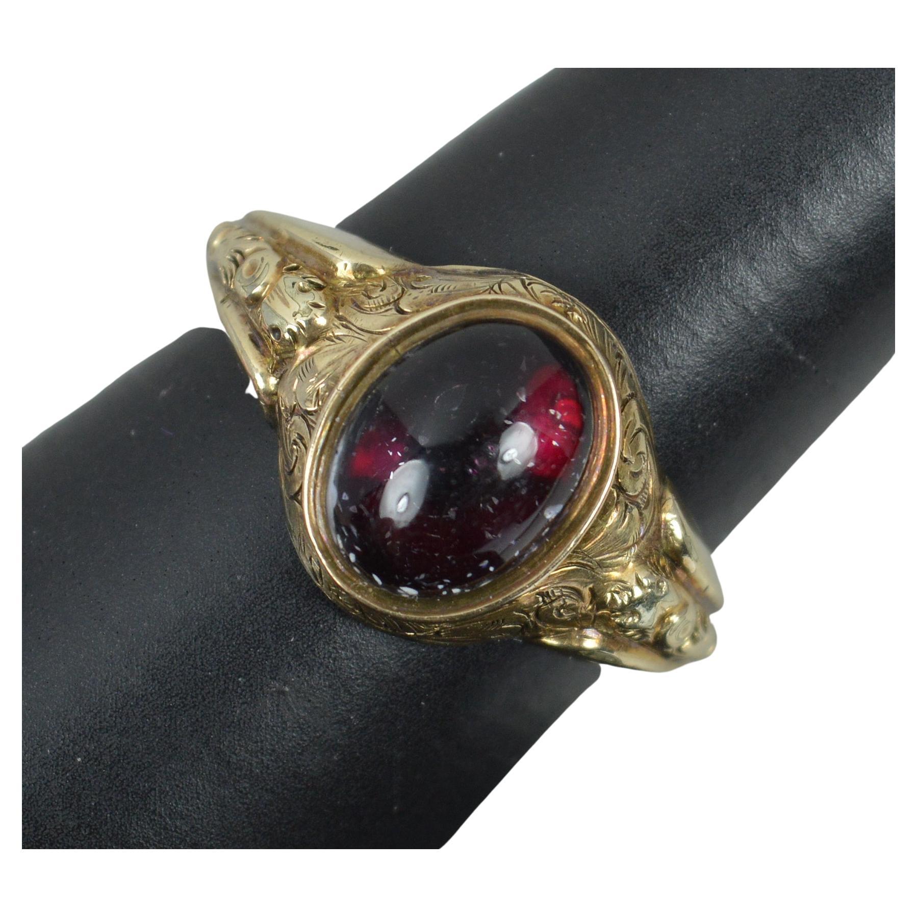 Victorian Foiled Garnet Cabochon and 9 Carat Gold Signet Solitaire Ring