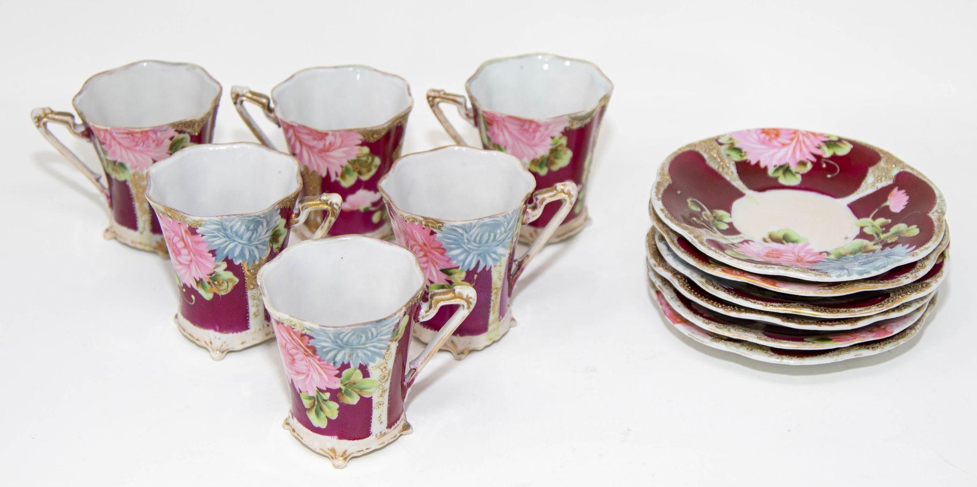 Victorian hand painted porcelain footed teacup and Saucer Set of 6 Circa 1930.
Decorative Victorian fine porcelain footed coffee or tea cup with saucer, hand painted with flowers in burgundy, pink, green, light blue and gold.
Set of 6 Victorian Era
