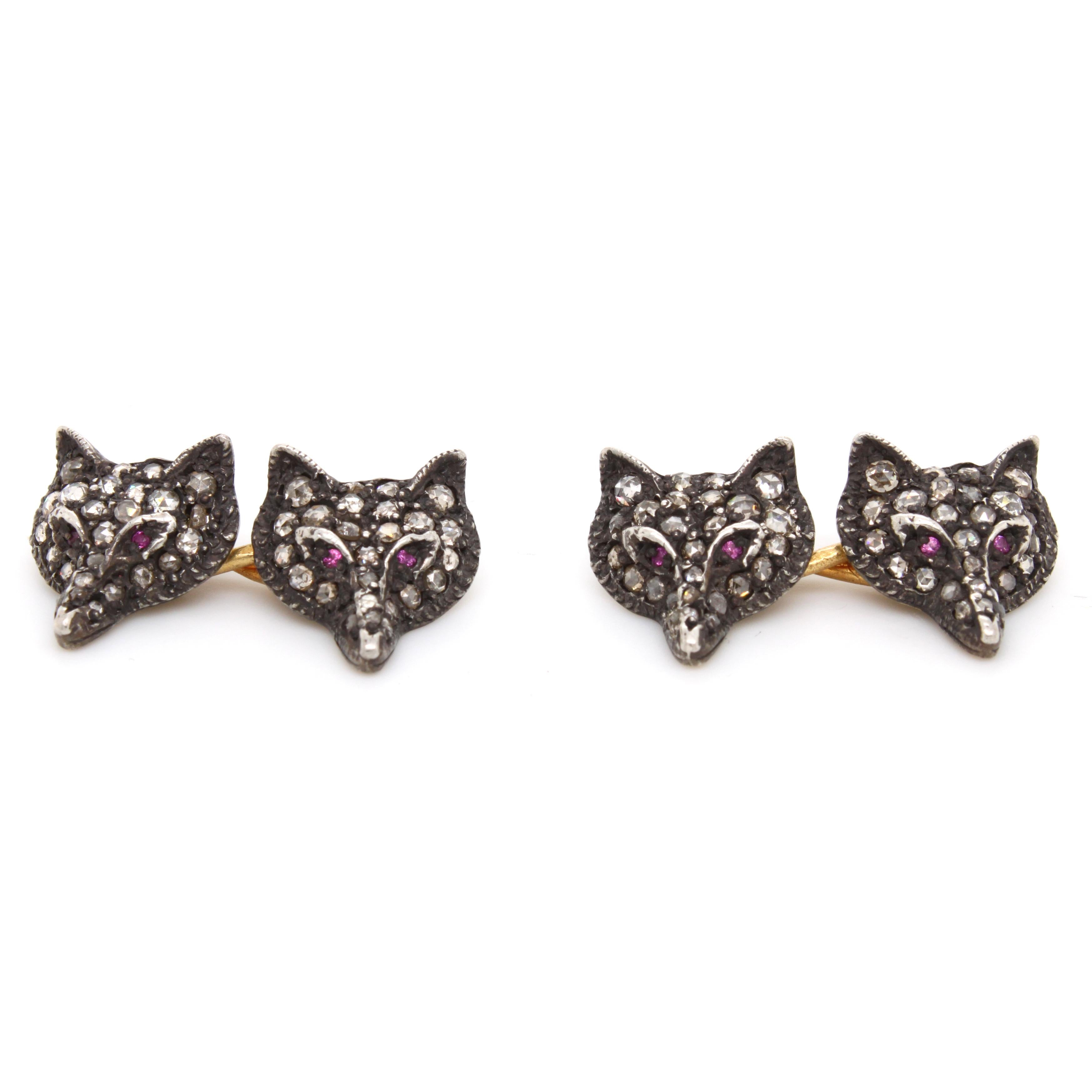 Victorian Fox Diamond and Ruby Cufflinks, ca. 1880s

A pair of cufflinks from the 1880s, featuring four foxes, made with bright rose-cut diamonds and ruby eyes.

Made in silver and gold with very good patina.
