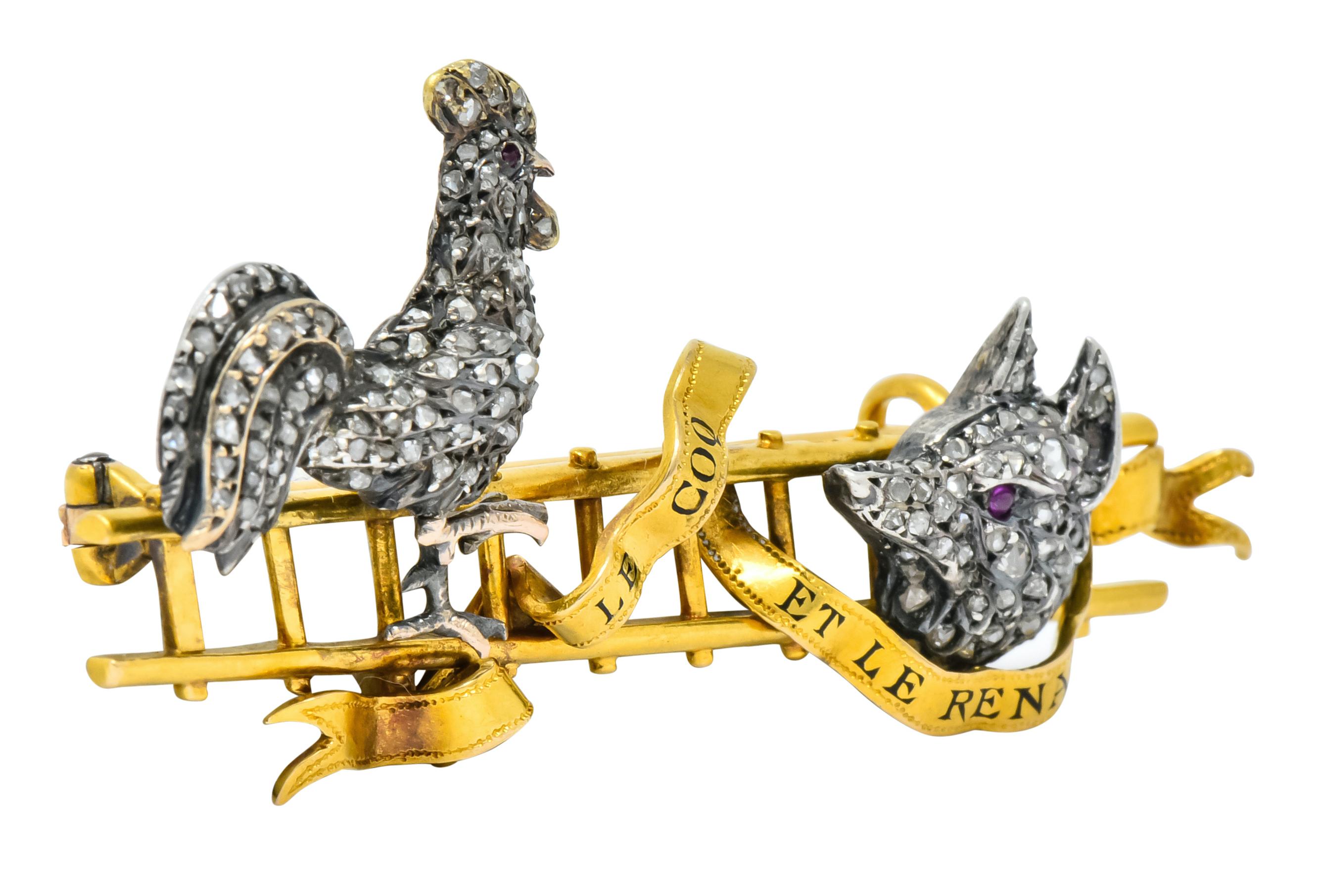 Designed as a silver rooster and fox perched on a gold ladder with a free-flowing ribbon 

“LE COQ ET LE RENARD” enameled throughout the ribbon, French for “The Rooster and the Fox