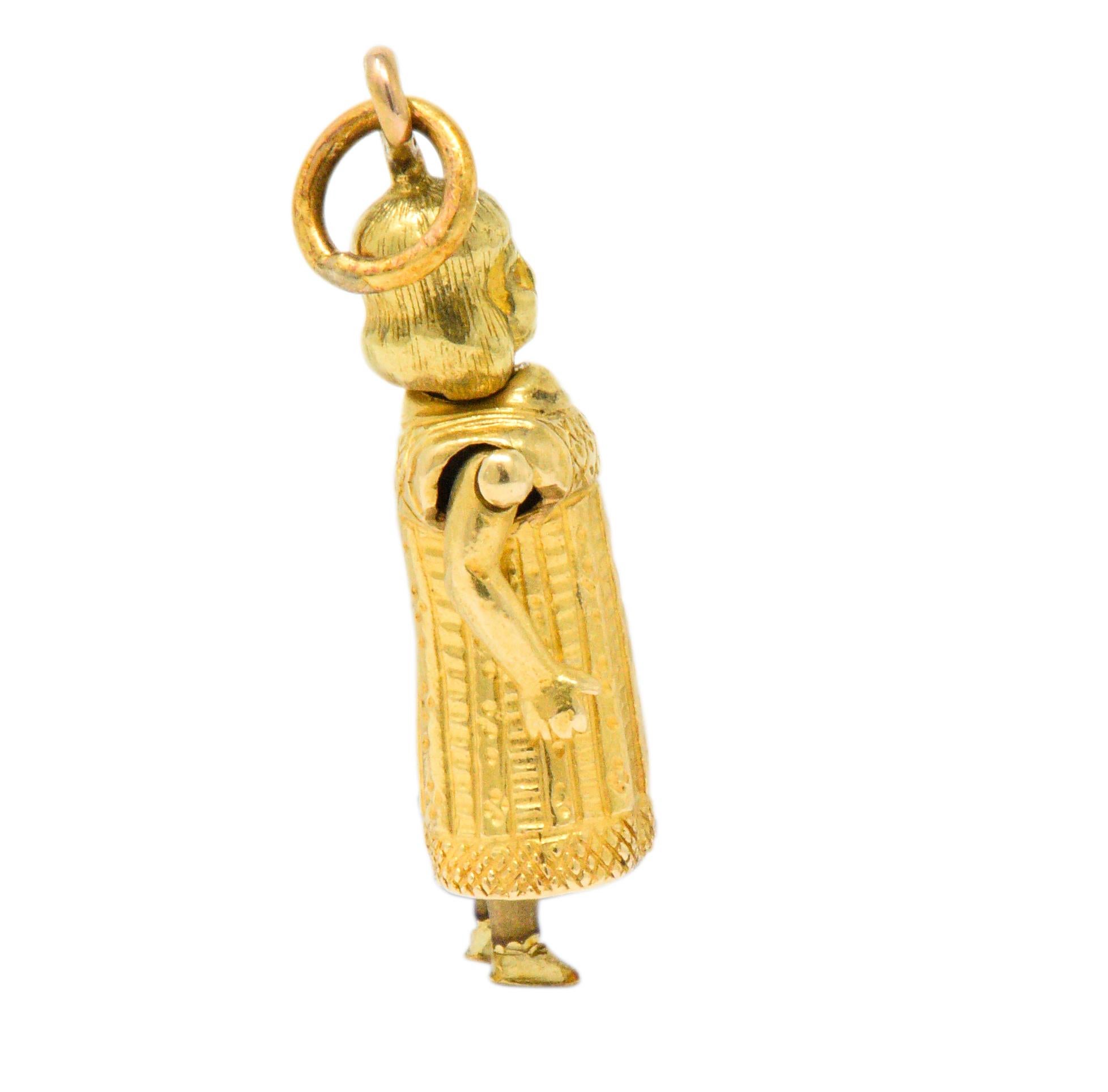 Featuring an 18kt yellow gold charm of a young girl

Articulated and providing movement of individual arms and legs

Intricately decorated dress

Tested as 18kt gold and French in origin

Circa 1890

Measures 18 mm x 8 mm

Dainty. Endearing.