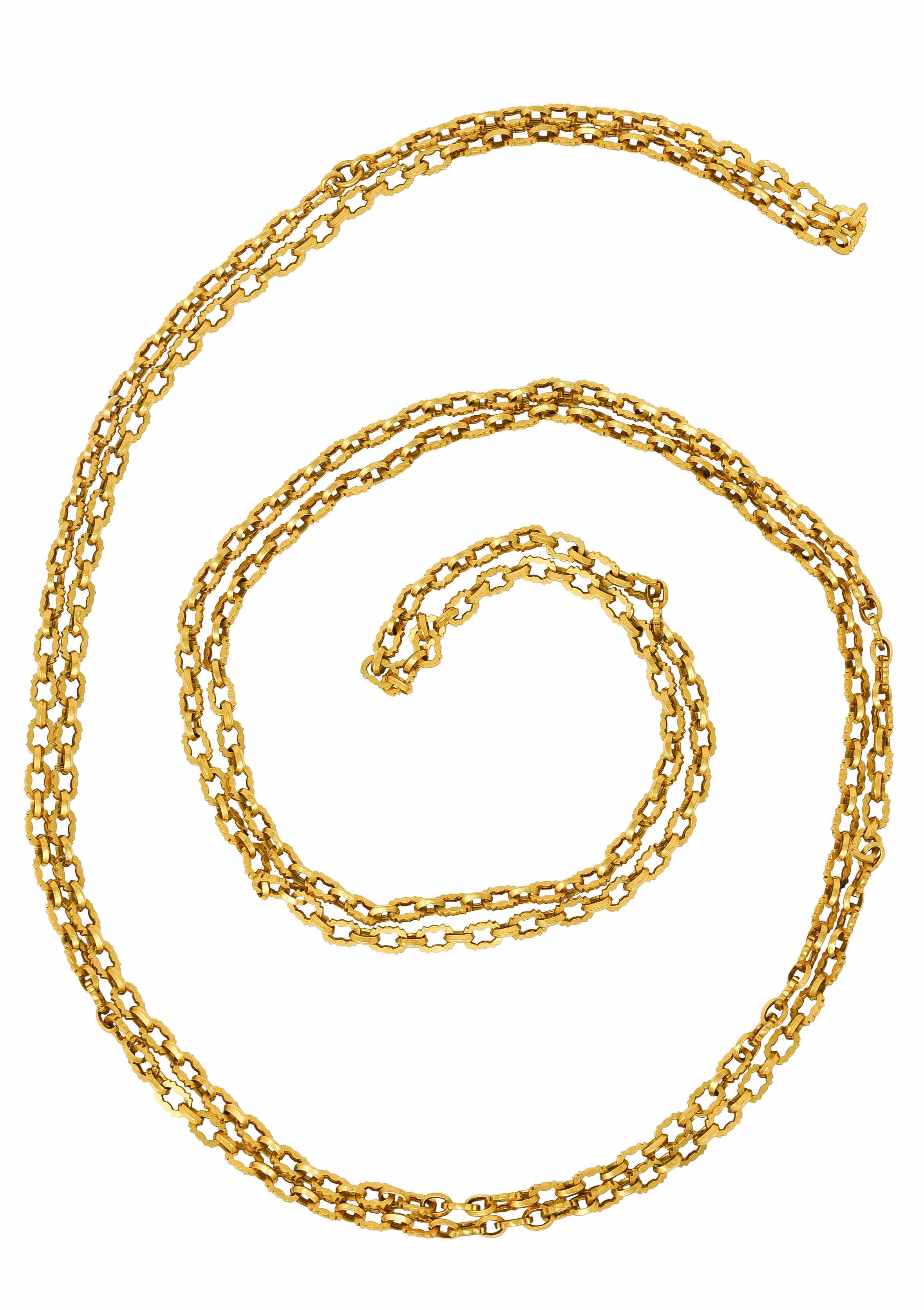 Long chain necklace is designed with stylized cable links

Featuring faceted oval links alternating with flat grooved links

Completed by closed jump ring

Tested with French hallmarks 18 karat gold

Circa: 1890's

Length: 58 inches

Width at