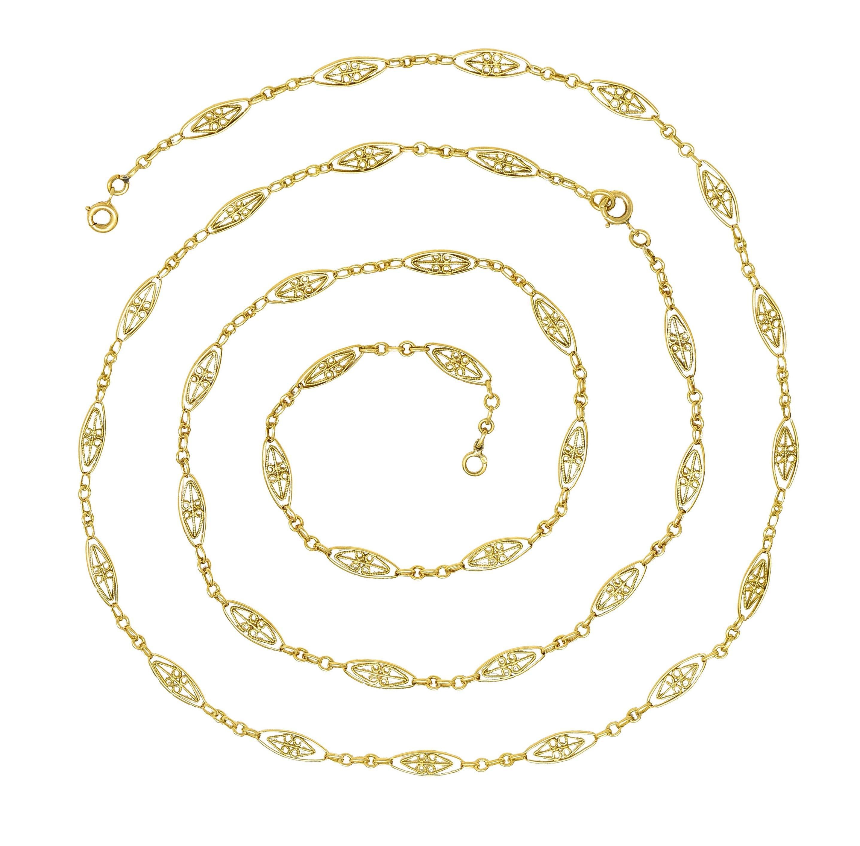 Comprised of navette-shaped links alternating in pattern with cable link chain
Navette links are pierced and feature scrolling heart motif filigree
Accented by milgrain detail  
Completed by spring clasp closure
Stamped with French hallmarks for 18