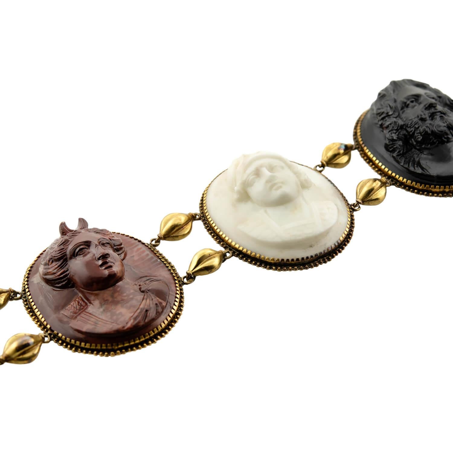 This gorgeous hand carved lava bracelet is from the Victorian (ca1880) era! The 18k yellow gold bracelet is bezel-set with five exquisitely carved in high relief cameos from Mount Vesuvius lavas. The cameos feature deities (Artemis, Ares, Zeus,