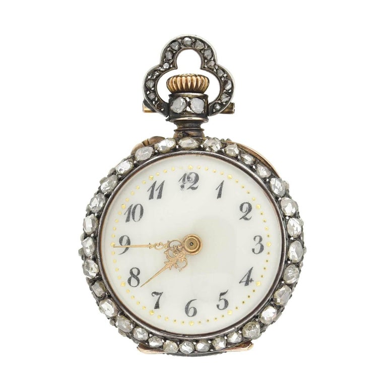 An absolutely exquisite diamond pocket watch from the Victorian (1880s) era! French in origin, this exceptional piece is crafted in 18kt gold and sterling silver, creating a subtle mixed metals appeal. On one side of the watch is an incredible
