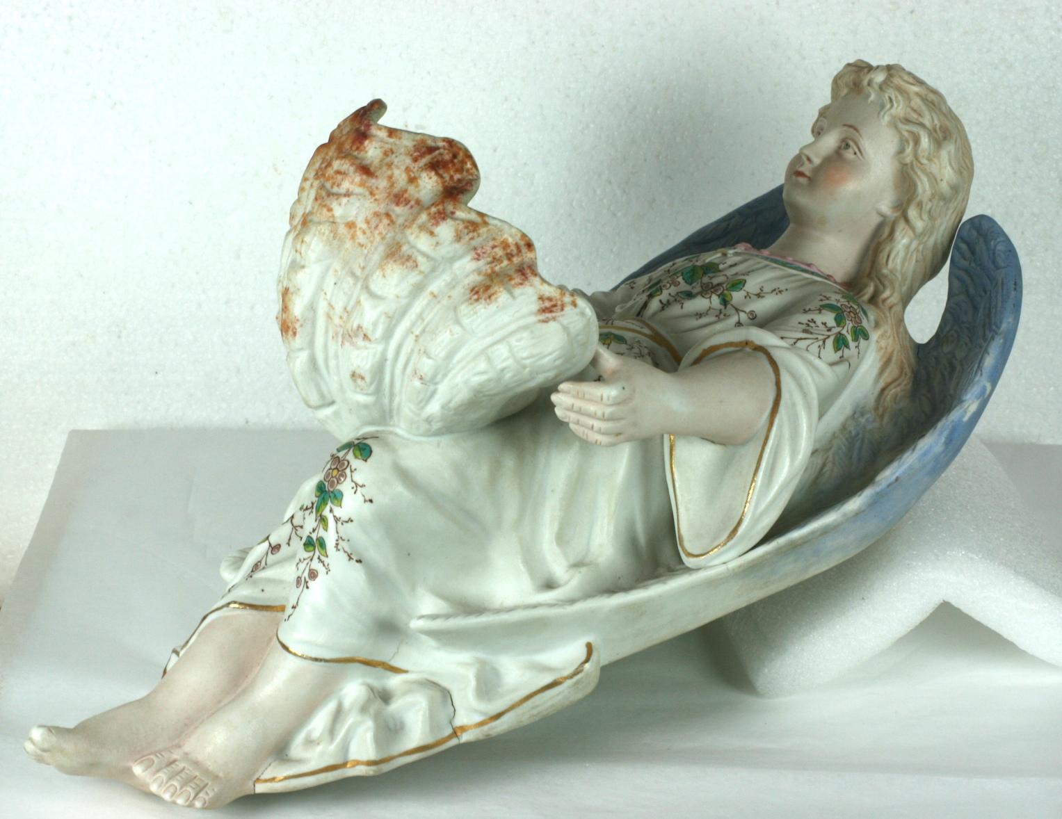 Lovely and large Victorian French Angel holy water font in bisque with glazed calm shell. Beautifully detailed hand painted decoration throughout. 
1900 France. Marked on side 