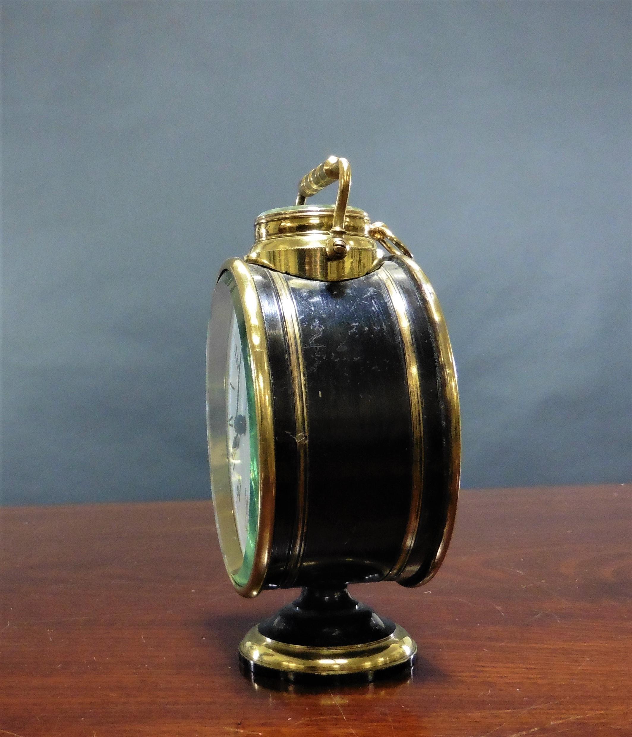 Victorian oval shaped carriage clock in a ‘patinated’ case standing on a raised circular base. 

Enamel dial with Roman numerals and original ‘blued’ steel hands. 

Eight day French movement with platform escapement. A compass is mounted on the