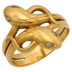 Anillo victoriano francés de oro amarillo de 18 quilates con diamantes y doble cabeza de serpiente