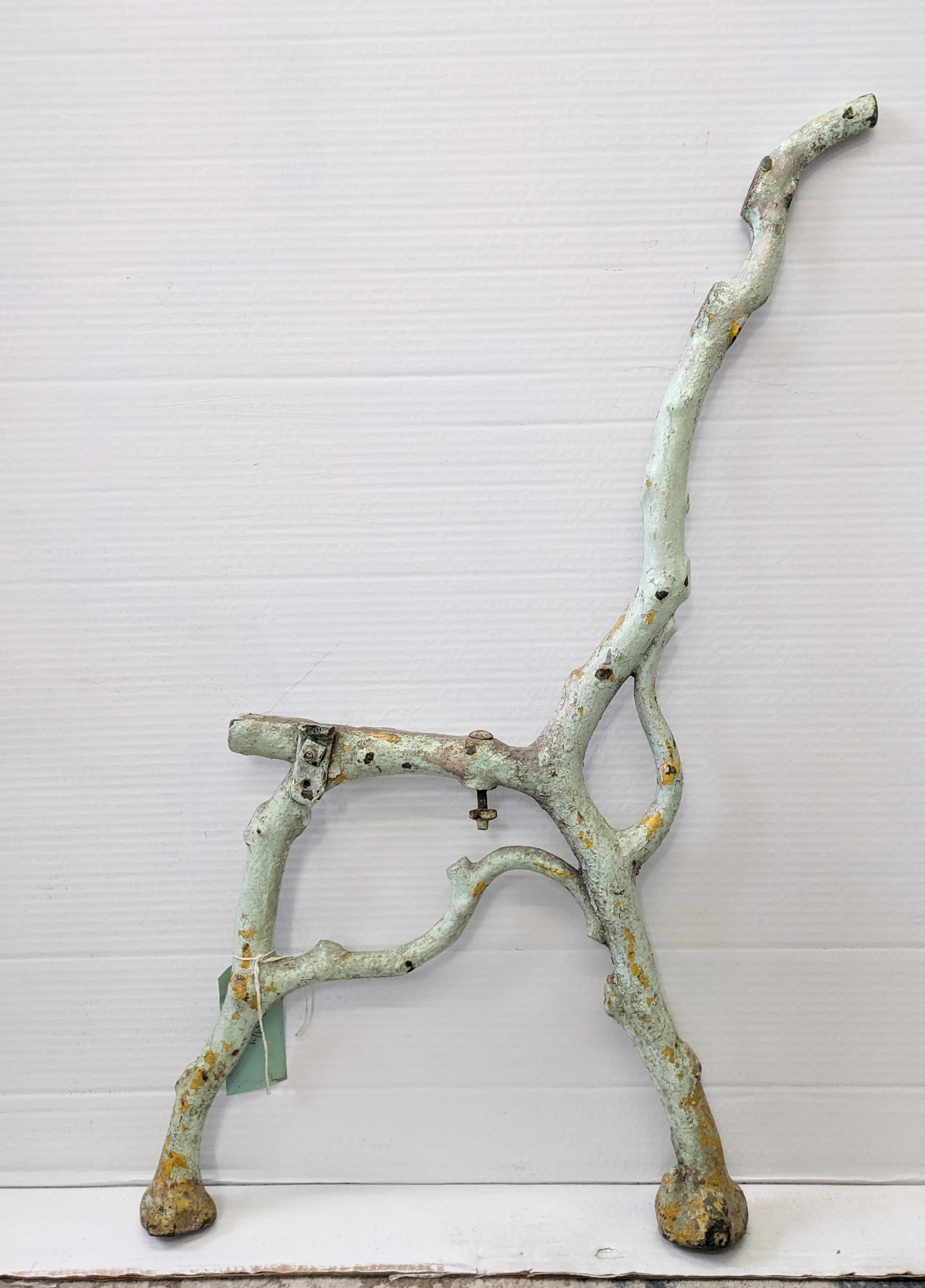 Pair of Victorian French Iron Faux Bois Bench Supports from the late 19th Century. Seafoam green, layered with many coats of paint with untouched patina. Made to look like naturalistic twigs in heavy cast iron. 
Normally wood slats would be bolted