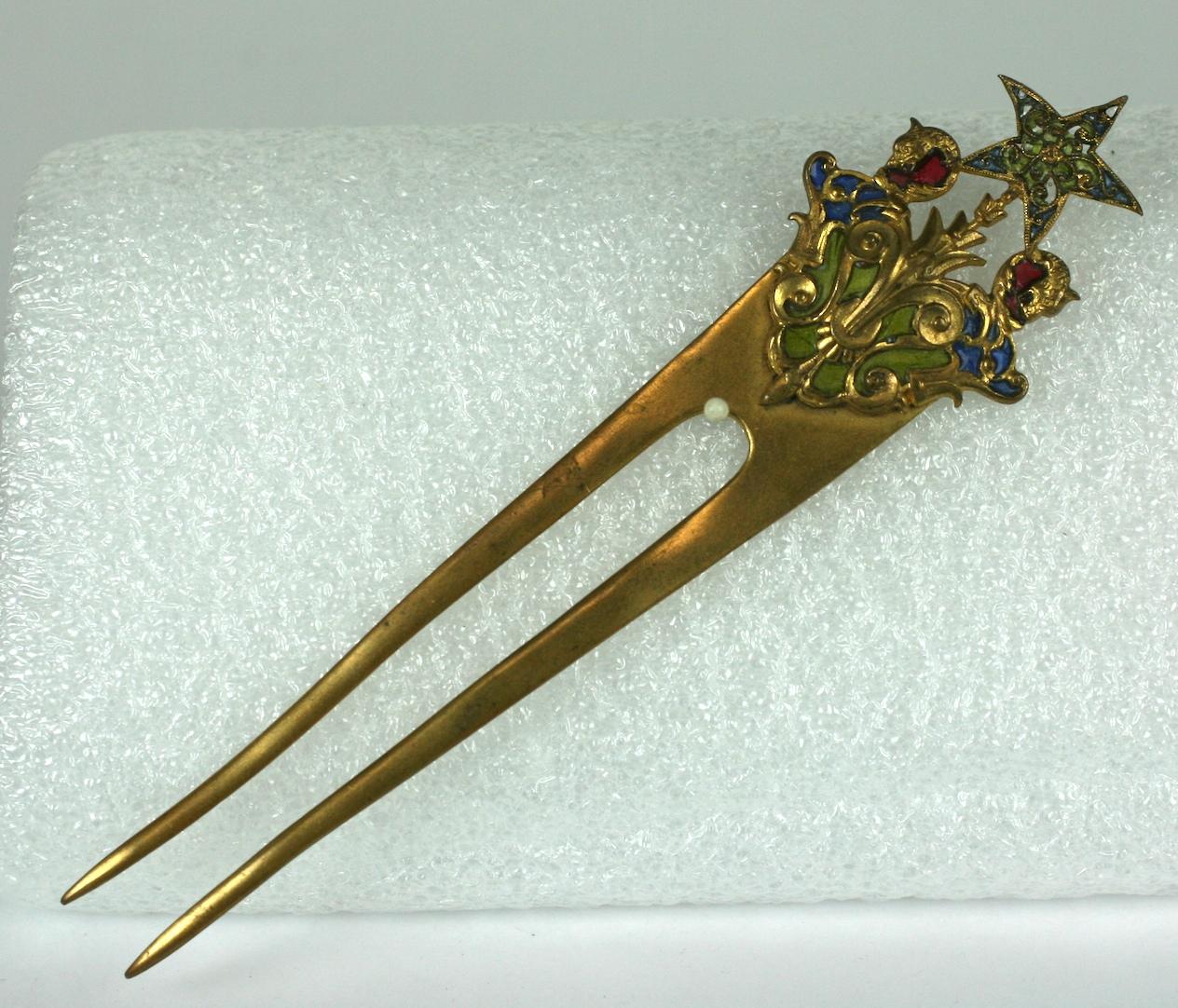 Lovely Victorian French Plique a Jour Hair Comb from the late 19th Century. Brass with transparent plique enamel in blue, ruby and greens. 
5.5