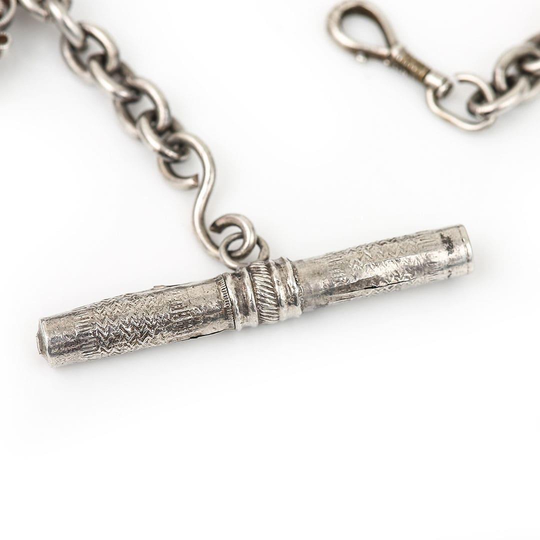 A rare a beautiful French Victorian silver long Albertina chain with masterfully decorated ‘sliders’ depicting horses and their jockeys. The silver herringbone link chain to the central aspect of the piece are kept in place by two hexagonal sliders