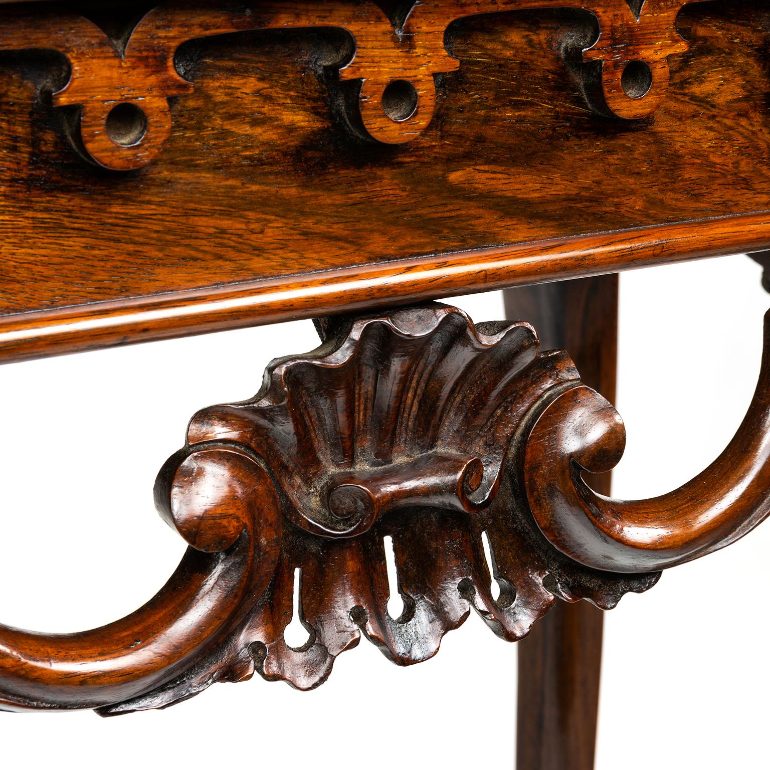A Victorian centre table in the French taste made with fine figured rosewood. probably made or at least retailed by Druce and Co.

As the owner of a fine London home during the early reign of Queen Victoria, a person of note would certainly have