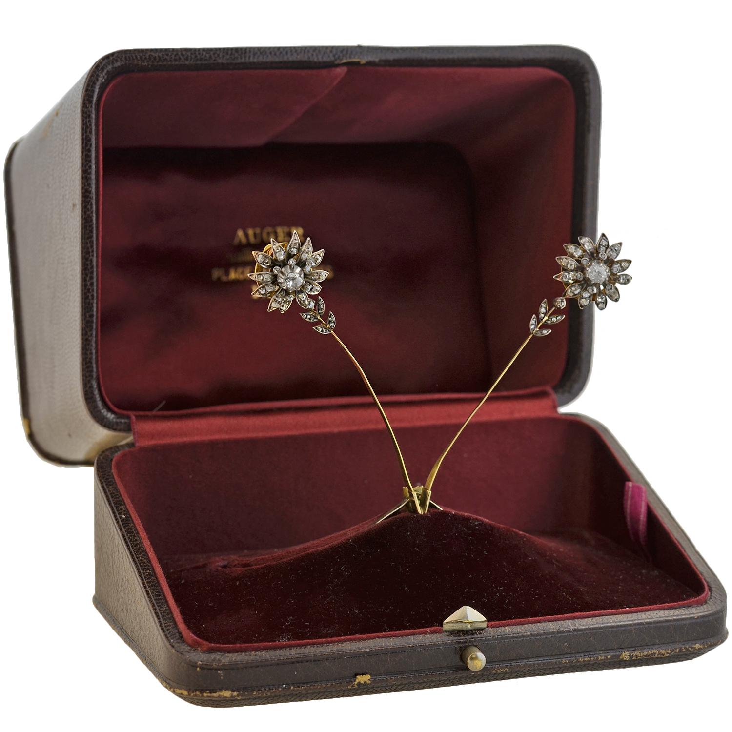 An exquisite and unusual regal tiara from the early Victorian (ca1850s) era! This beautiful and rare piece is crafted in sterling silver and 18kt yellow gold and adorns two tremblé style diamond flower aigrette's which sprout up on either side of a