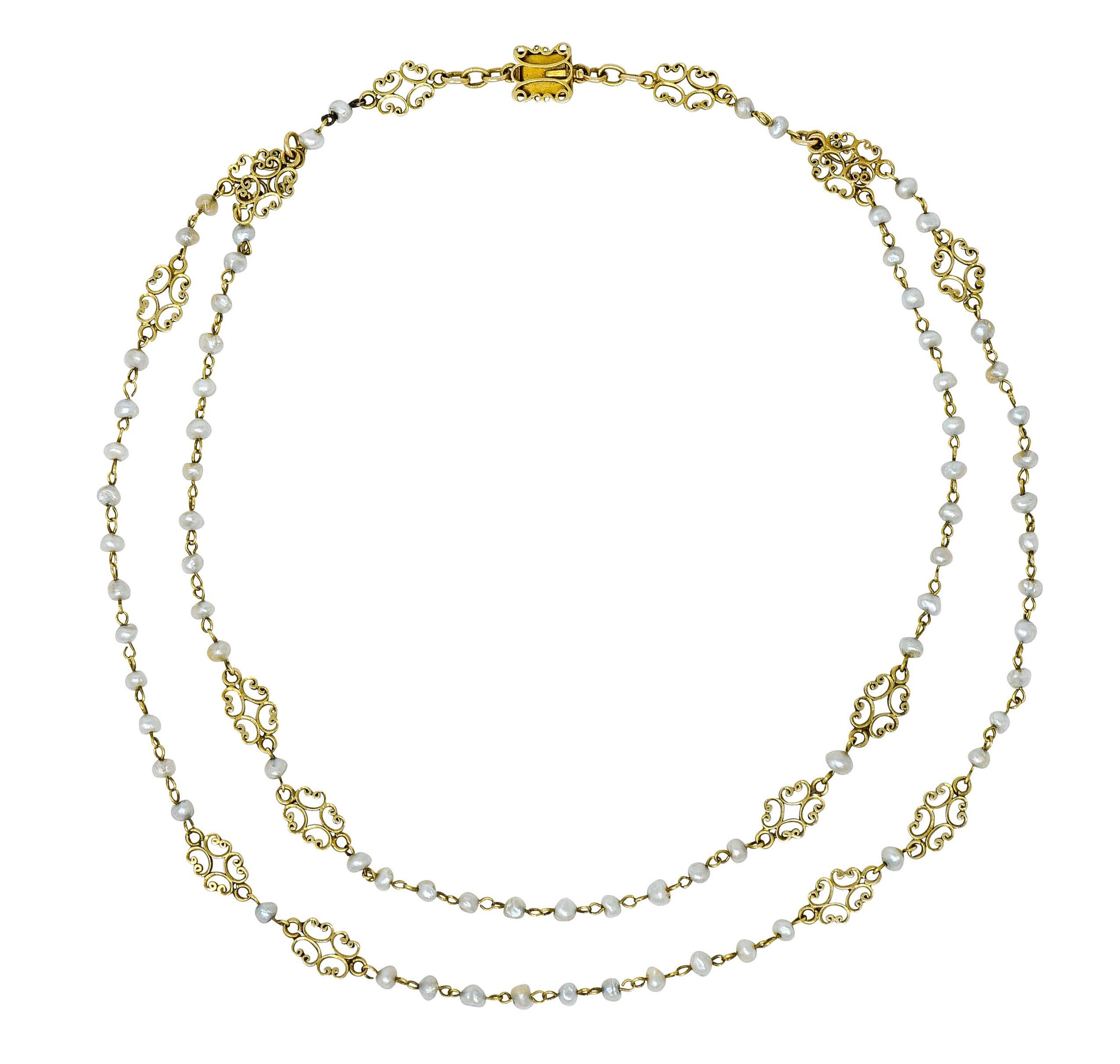 Necklace features two strands of pigtailed freshwater natural pearls measuring approximately 3.5 mm to 4.0 mm

Well-matched with cream body color and strong silvery overtones, good to very good luster

Accented throughout by scrolled filigree
