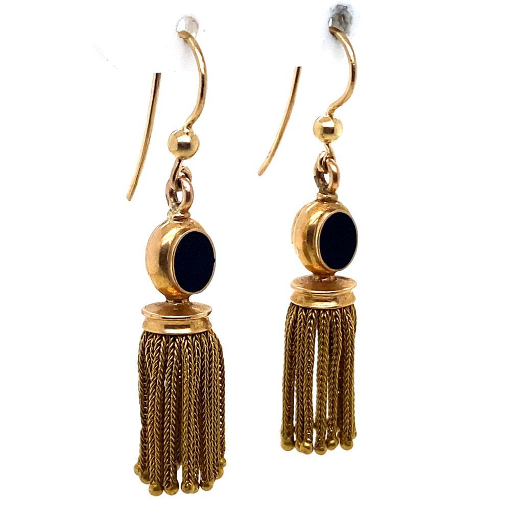 A pair of Victorian fringed earrings with oval onyx detail set in 18 karat yellow gold.

The tops of these yellow gold earrings are oval shaped each set with two slices of polished onyx, suspending meticulously crafted gold fringes, each individual