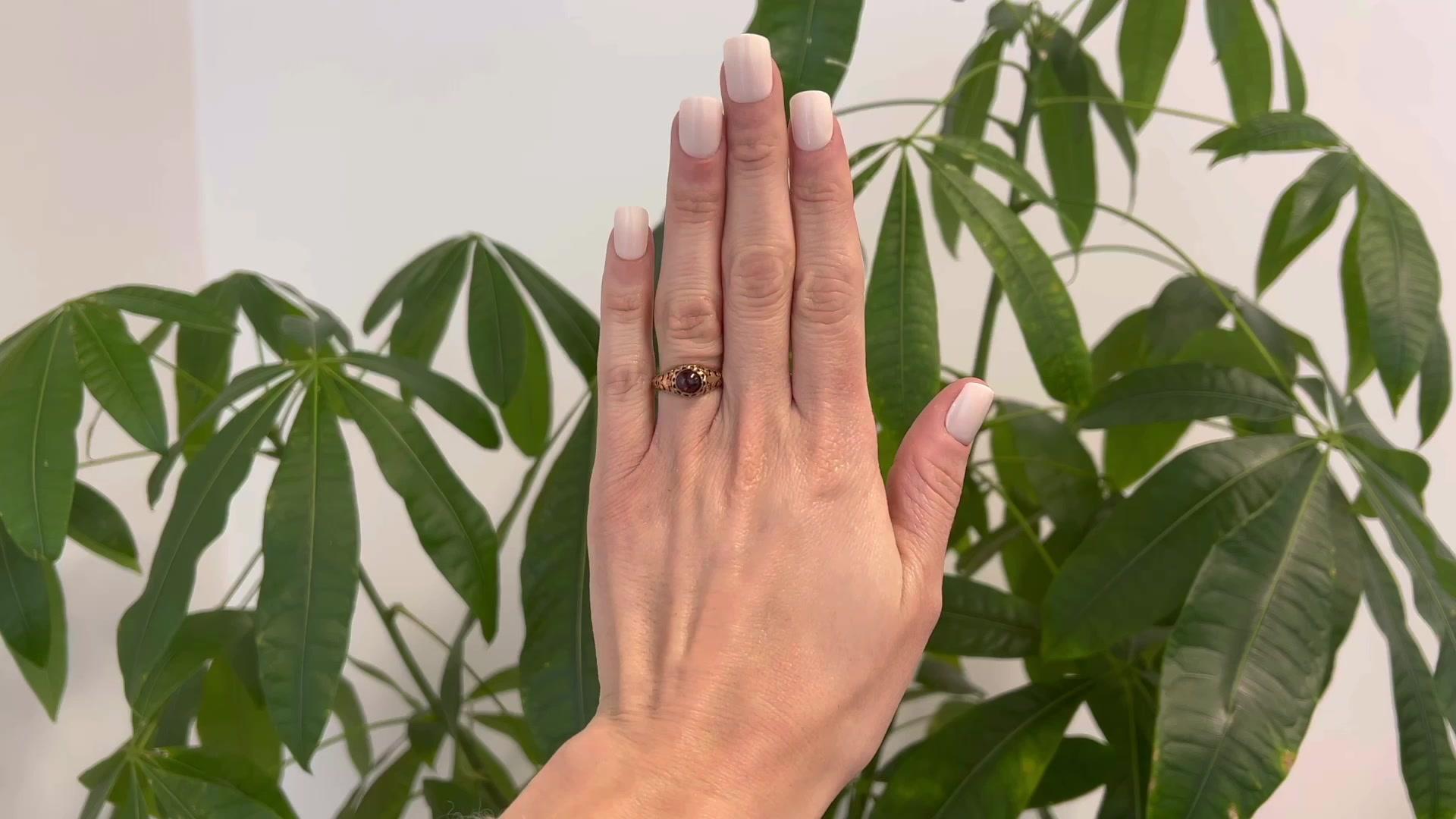 One Victorian Garnet 14 Karat Rose Gold Filigree Ring. Featuring one cabochon garnet weighing approximately 0.10 carat graded in the mounting. Crafted in 14 karat rose gold. Circa 1870. The ring is a size 8 and may be resized.

About this Item: