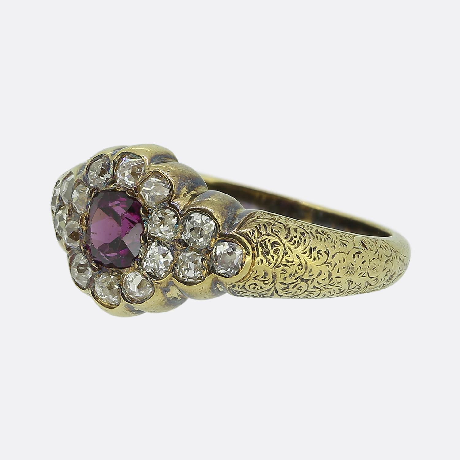 Here we have a sweet and stylish ring dating back to the Victorian period. This antique piece has been crafted from a warm 18ct yellow gold and focally features a rich pinky red garnet at the centre of the face. This principal stone is contained by