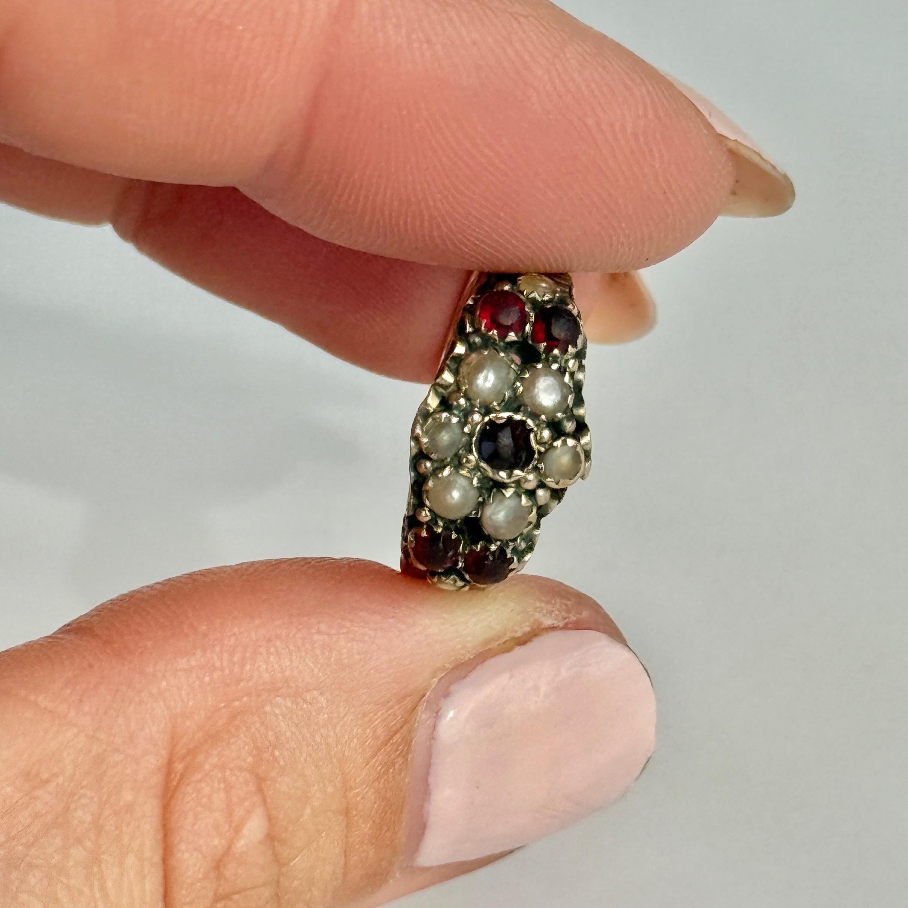 There are five larger garnet stones measuring 5pts each and 8 pearls.  Fully hallmarked Birmingham 1884. 

Ring Size: J or 4 3/4
Face Width: 9mm

Weight: 1.2g