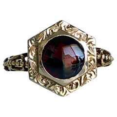 Anello vittoriano con granato cabochon in filigrana 14k
