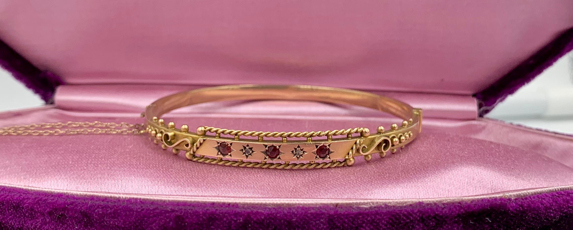 A delightful Victorian Bracelet set with round faceted Garnet and Diamond gems in an Etruscan Revival design in 9 Karat Rose Gold.  The wonderful red garnets alternate with the antique diamonds in star motif settings.  The beautiful Etruscan Revival