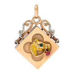 Victorian Garnet Glass 14 Karat Tri-Colored Gold Horse Locket Pendant
