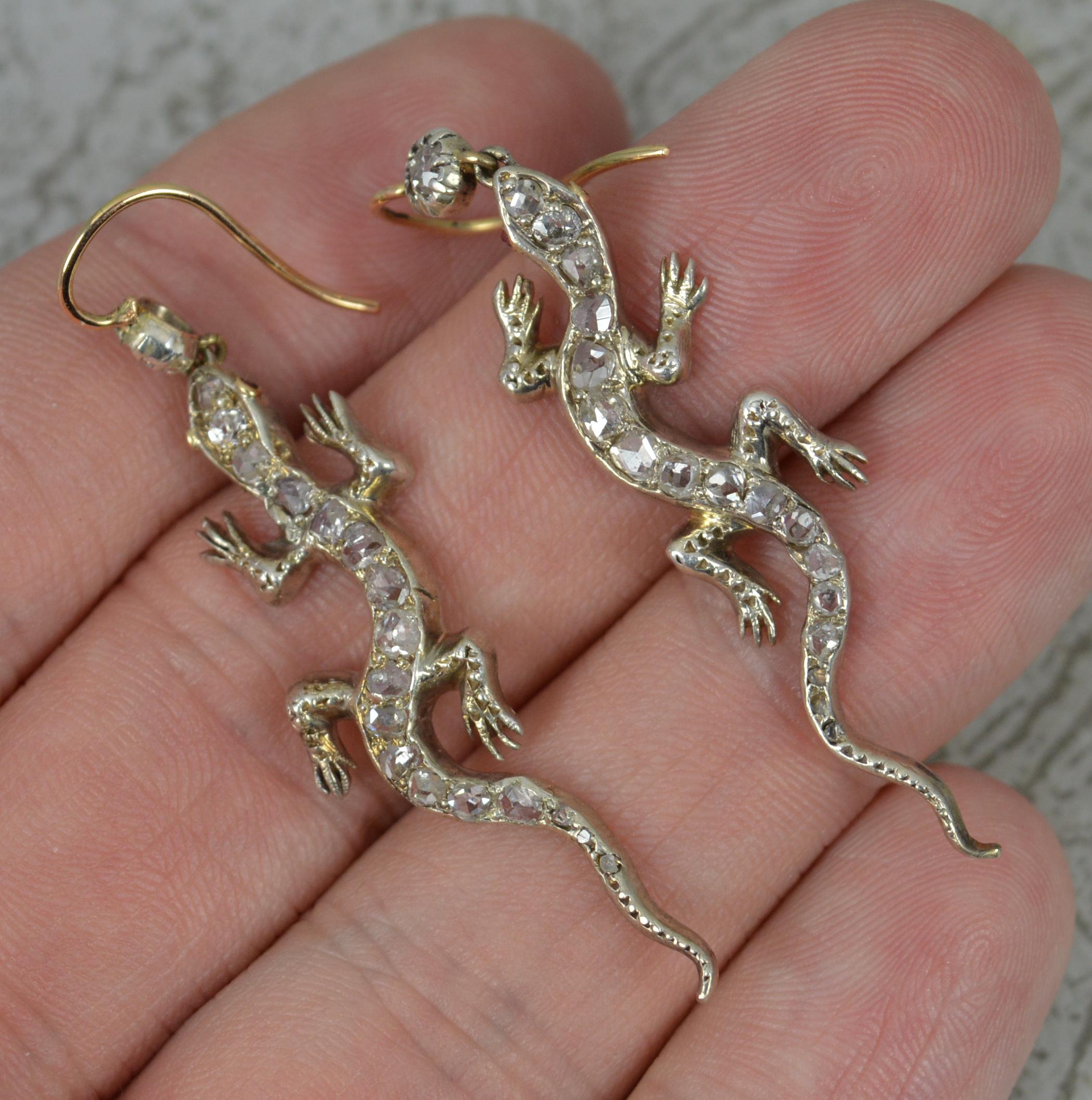 A stunning true Victorian period pair of earrings.
Circa 1860-80.
Solid 15 carat rose gold example with silver settings, typical of the period.
Finely made in the form of a gecko or newt. Encrusted with many natural rose and old cut diamonds