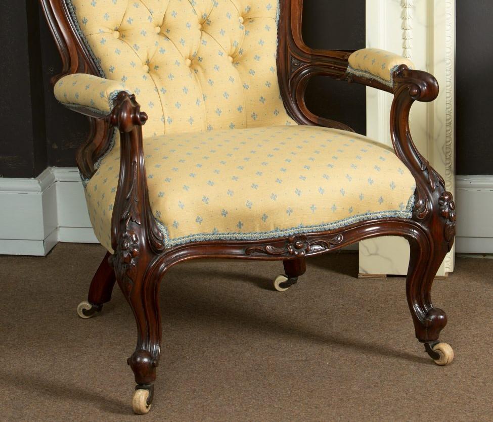 Gentleman’s open armchair, mahogany arch shaped back with Acanthus carving, yellow upholstery, carved cabriole legs, c.1860.