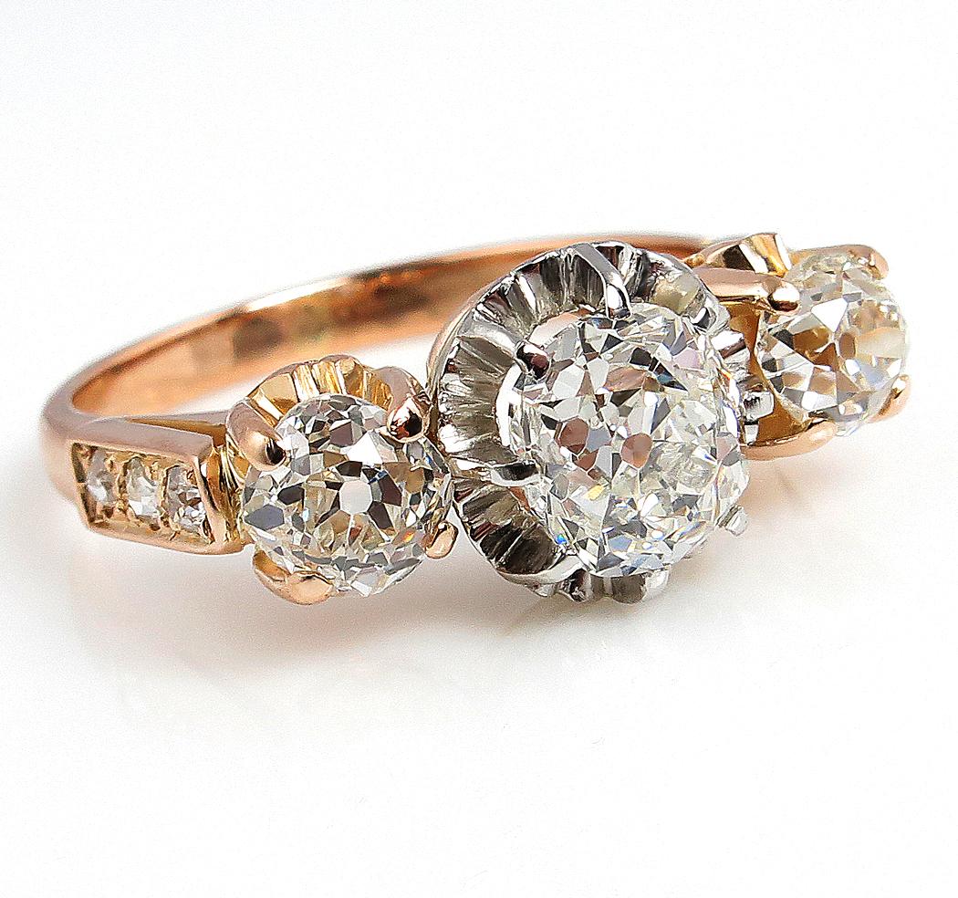 The Victorian Period is named for the reigning monarch who was reputedly an incurable romantic. Victorian Jewelry virtually drips with sentimentality and symbolism.

This highly ornate Three-Stone engagement ring of notable feminine grace was, still