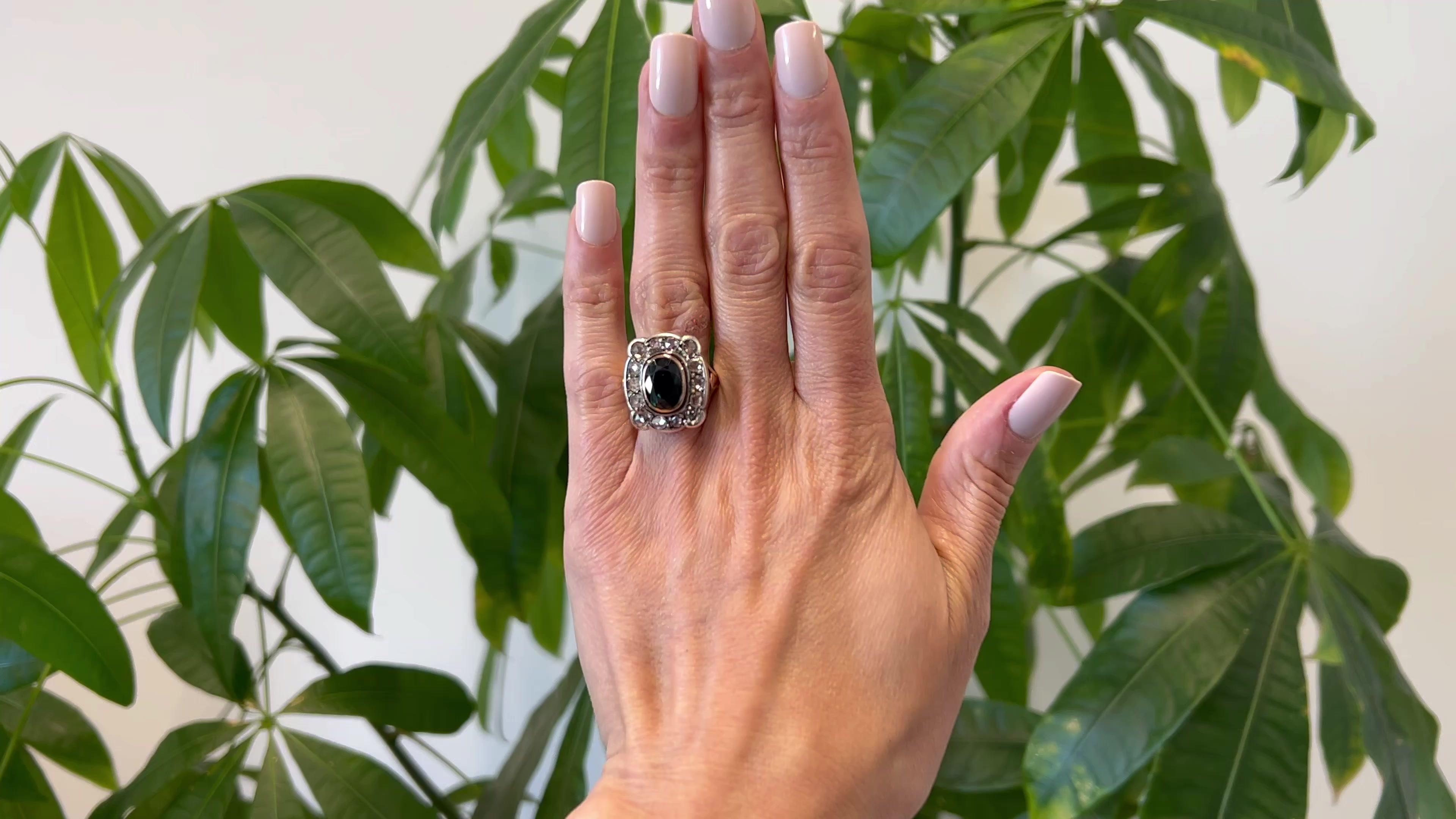 One Victorian GIA Australian No Heat Sapphire and Diamond Silver 18k Gold Cluster Ring. Featuring one GIA oval mixed cut dark greenish blue sapphire weighing approximately 3.75 carats, accompanied with GIA #2231054512 stating the sapphire is of