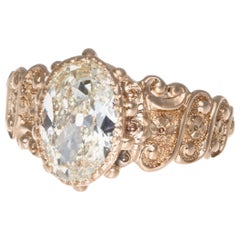 Victorian GIA Certified 1.59 Carat Oval Cut Diamond 14 Karat Rose Gold Ring