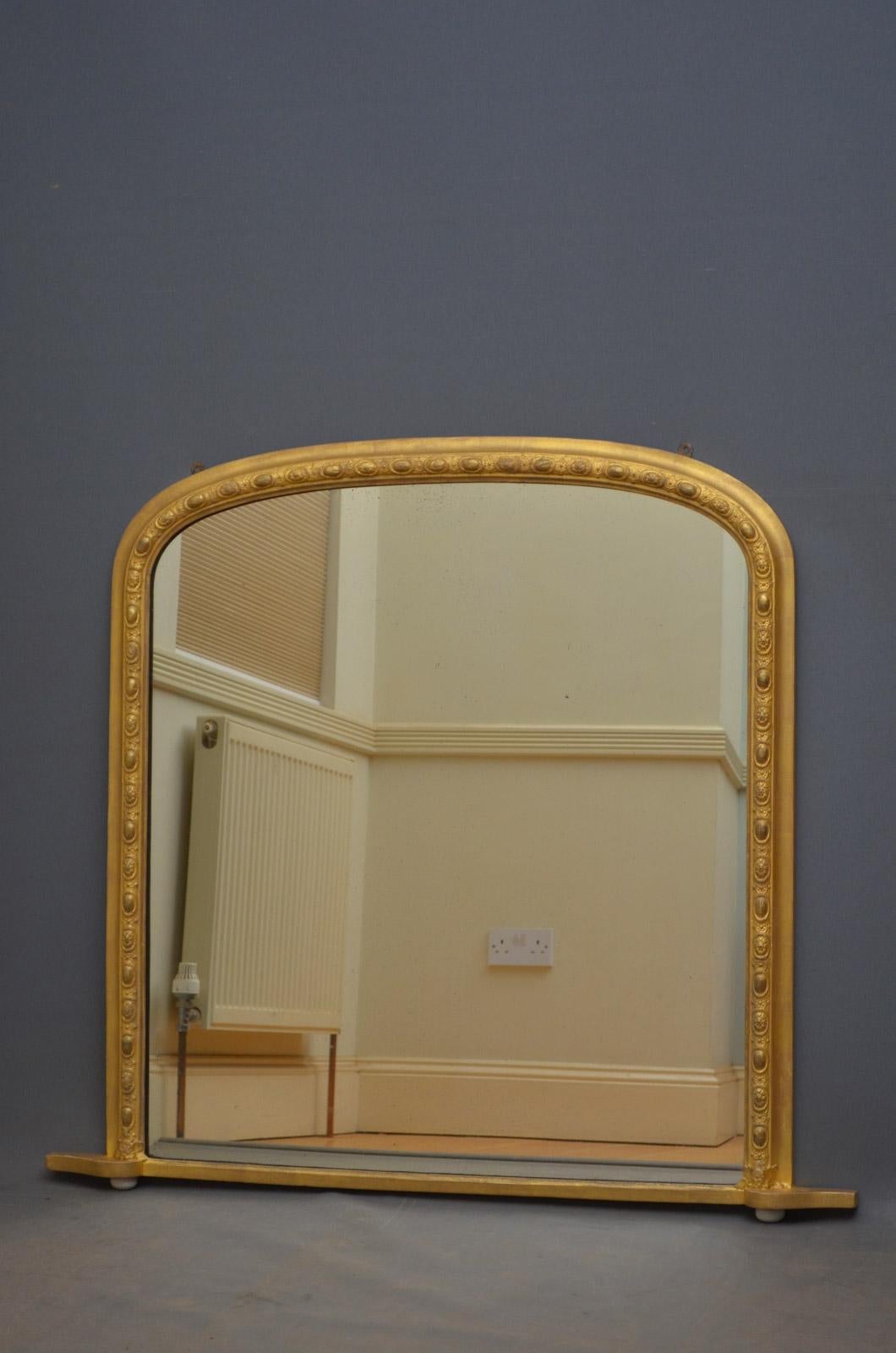 K0332 Victorian gilt overmantle mirror, having original mirror plate with some foxing in decorative frame. This antique mirror has been regilded in 23 carat gold leaf, ready to place at home, circa 1870.
H41