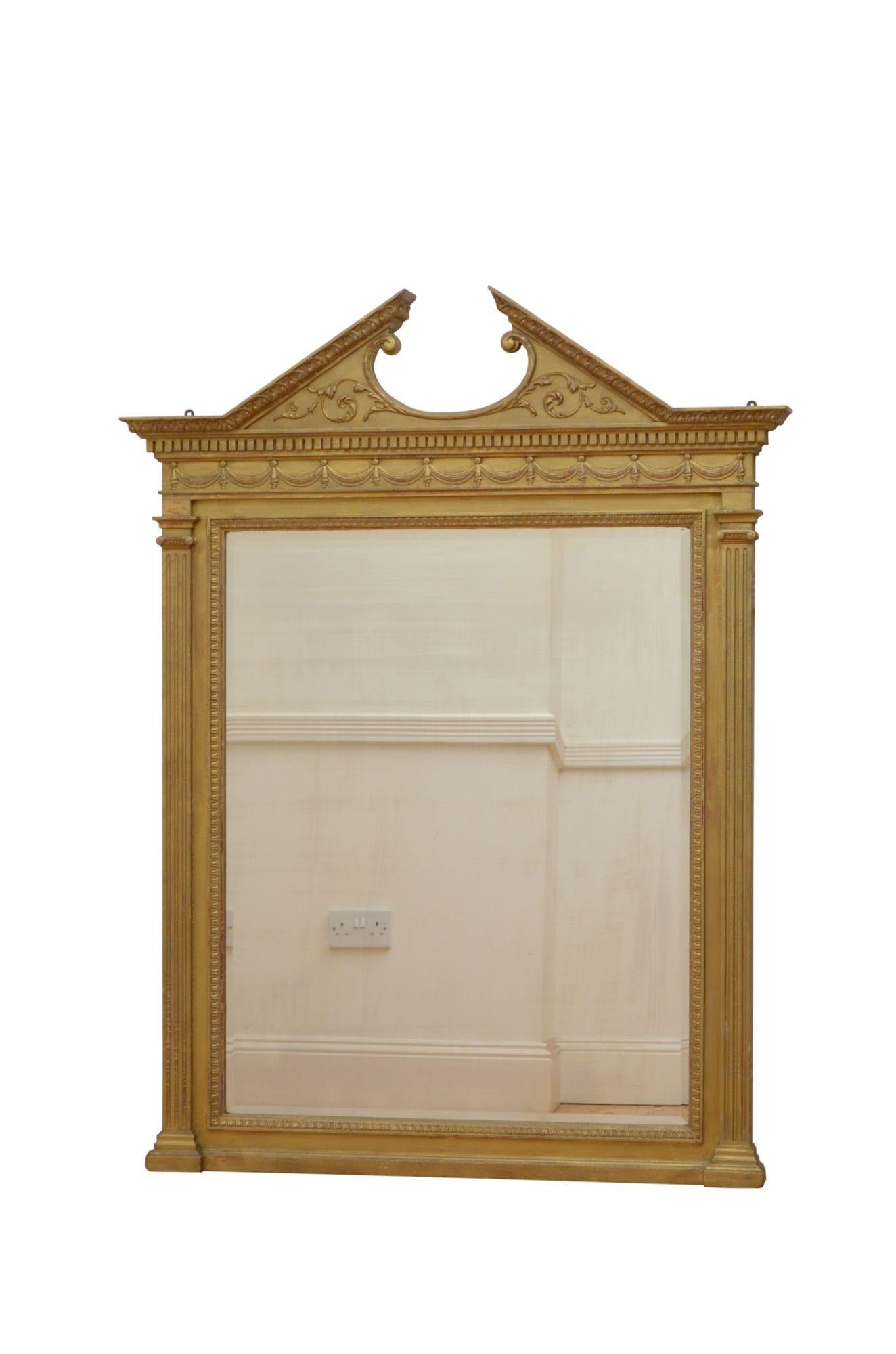 P0270 A Victorian gold wall mirror, having architectural pediment with acanthus leaf carved moulding, scrolls and dentil cornice above swag carved frieze and original bevelled edge mirror with some foxing flanked by reeded columns with carved