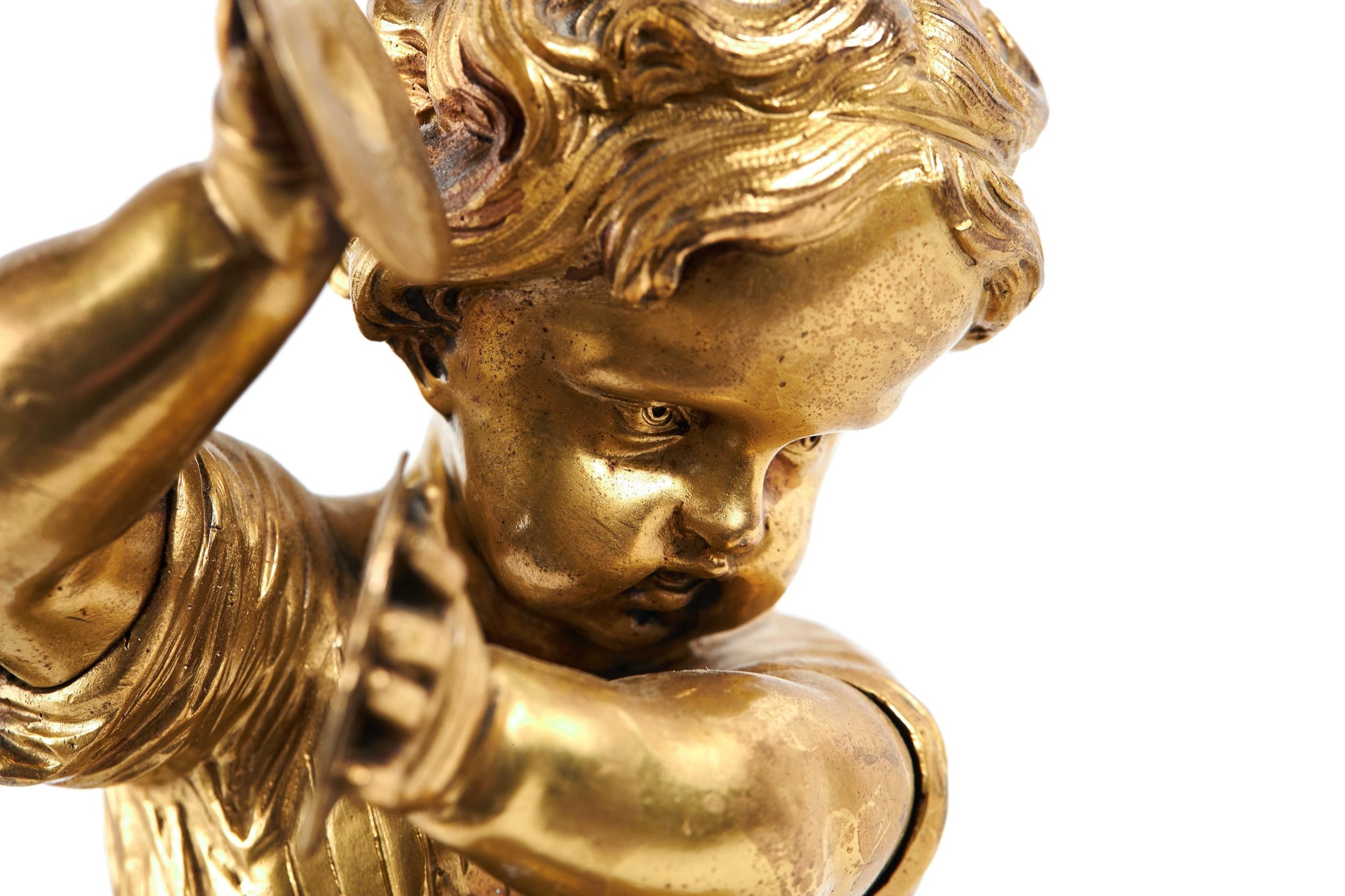 Cast Victorian Gilt Bronze figure of a child playing the Cymbals For Sale