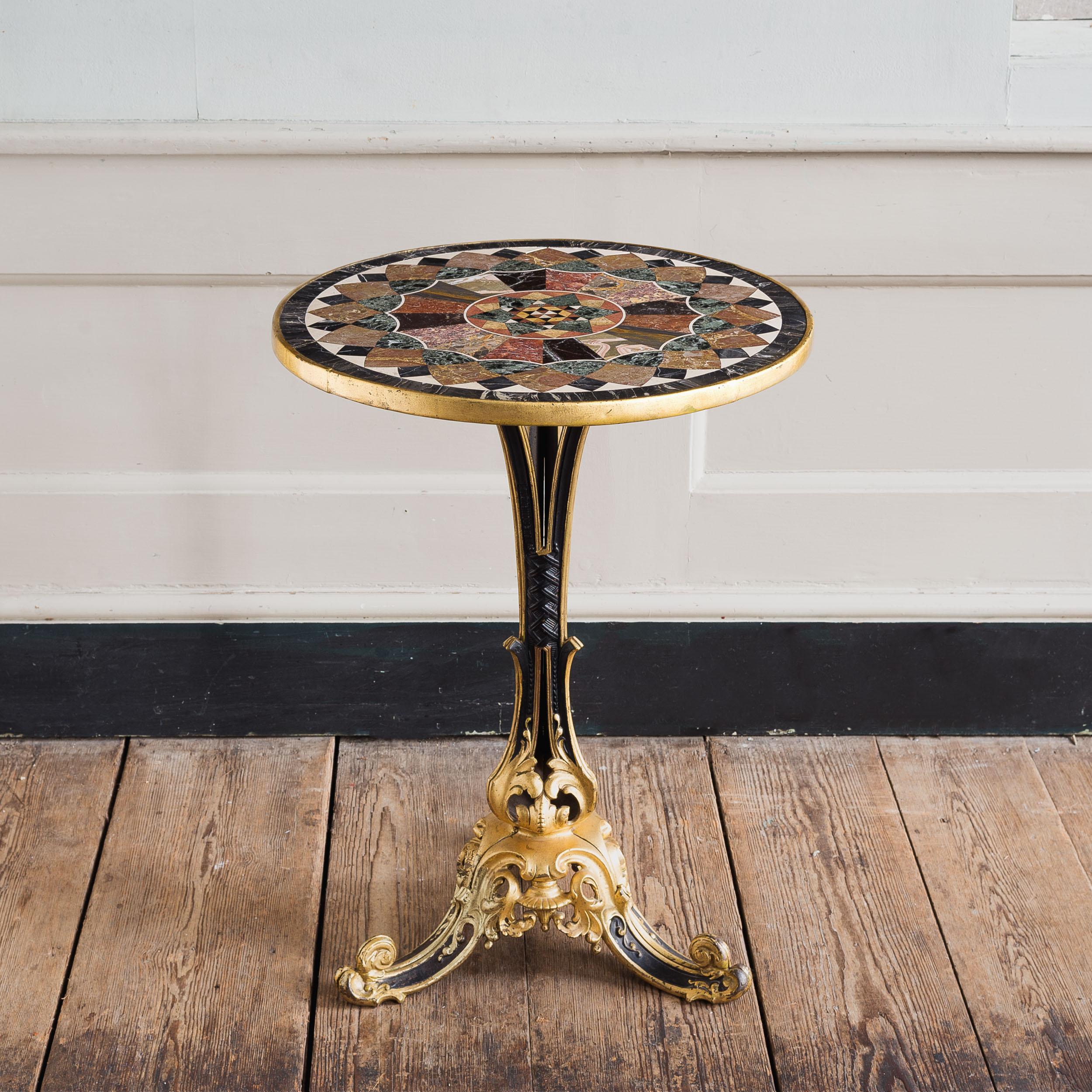 A fine Victorian parcel-gilt cast iron and specimen marble table, stamped 'THE ROTHERHAM', the top inlaid with marbles to a geometric design, c.1870-1880.

