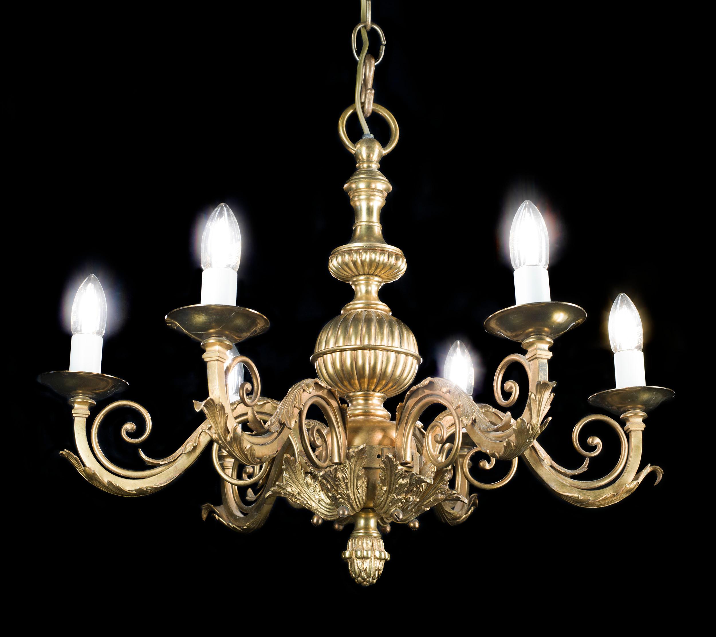 A Victorian gilt bronze five branch chandelier, the scrolling swan neck arms surround a fluted baluster stem. Its compact size makes it really diverse and it can be used in different rooms.
English, c.1890.

Ceiling rose not included