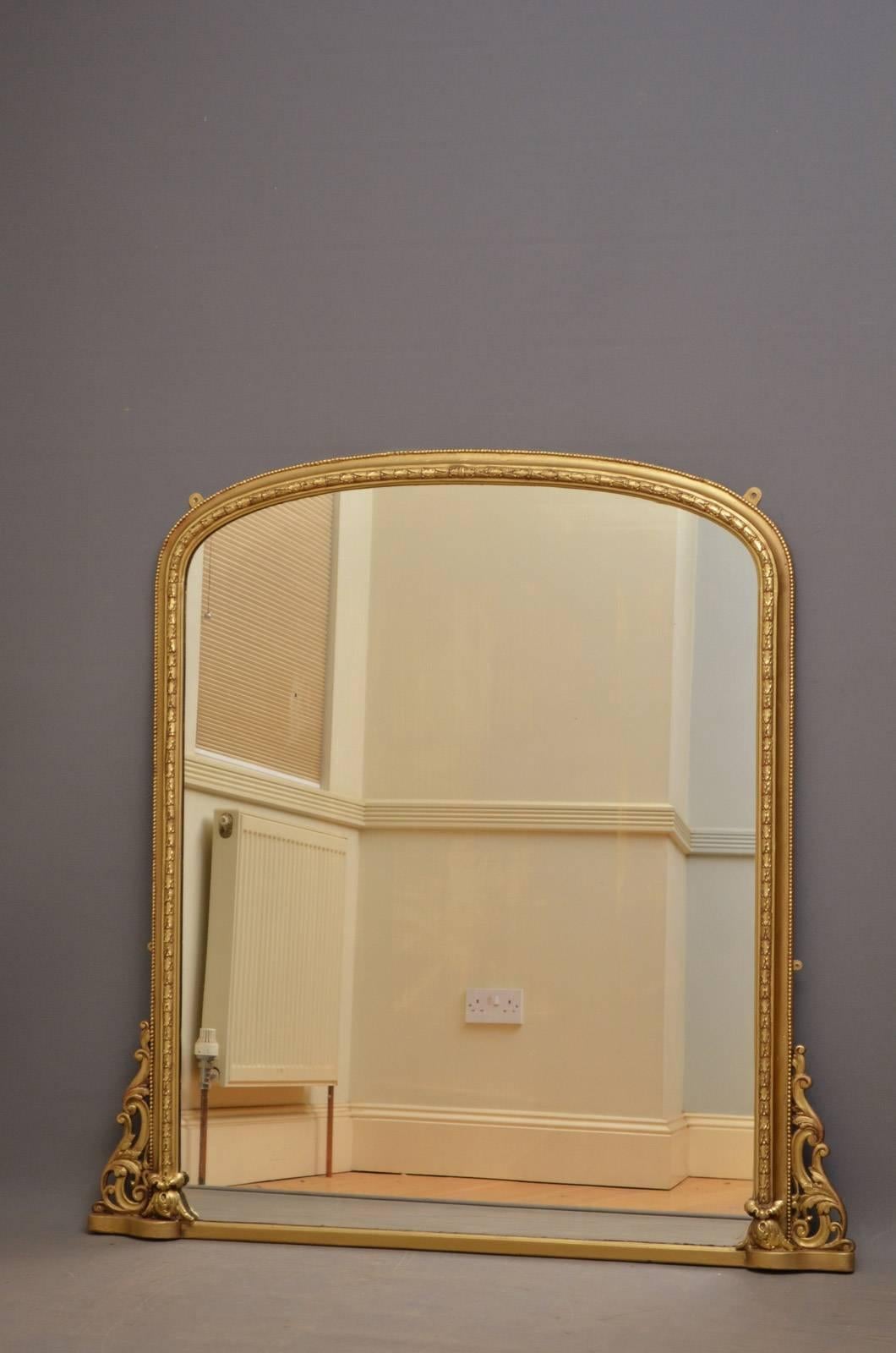 K0284 excellent English, Victorian gilt mirror, having original mirror plate in carved and moulded frame with fine scroll carvings to sides. This Victorian overmantle, wall mirror has been refinished in the past and is in wonderful condition