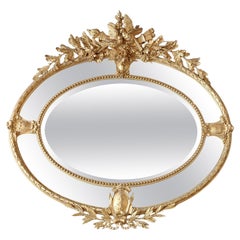 Miroir mural ovale en bois doré et gesso de style victorien