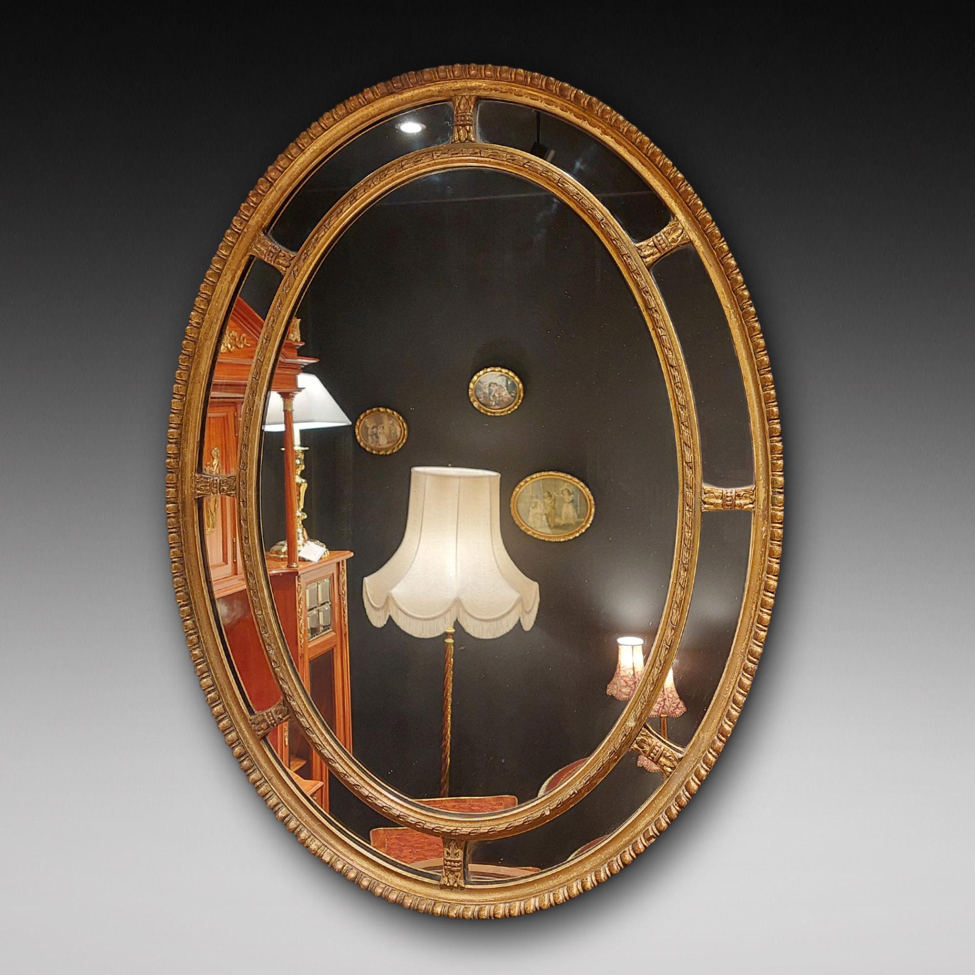 Victorian Giltwood & Gesso Oval Wall Mirror in George III Style, with a central plate inside a segmented border, with beaded frames c1860 - 25