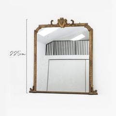 Victorian Giltwood Mirror with a cherub mask cartouche. Circa 1880.