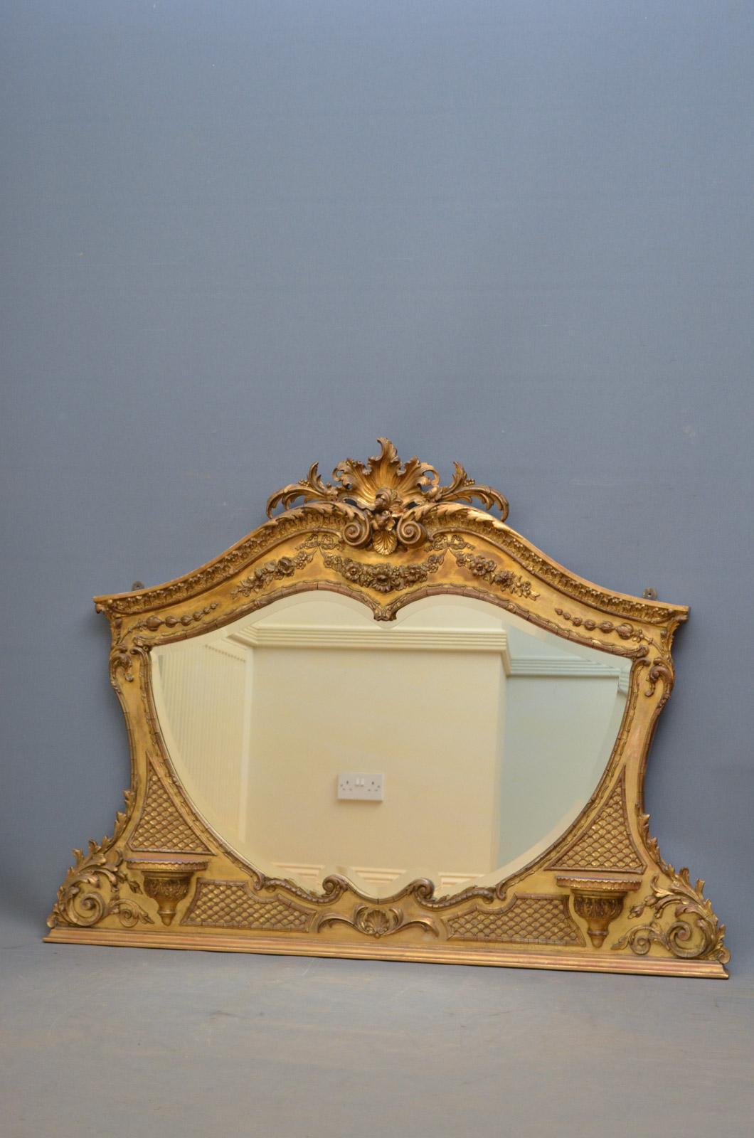 K0348 unusual Victorian gilded overmantle mirror of horizontal form, having original bevelled edge mirror plate in finely carved frame. This antique mirror retains its original glass, gilt and backboards, all in wonderful home ready condition, circa