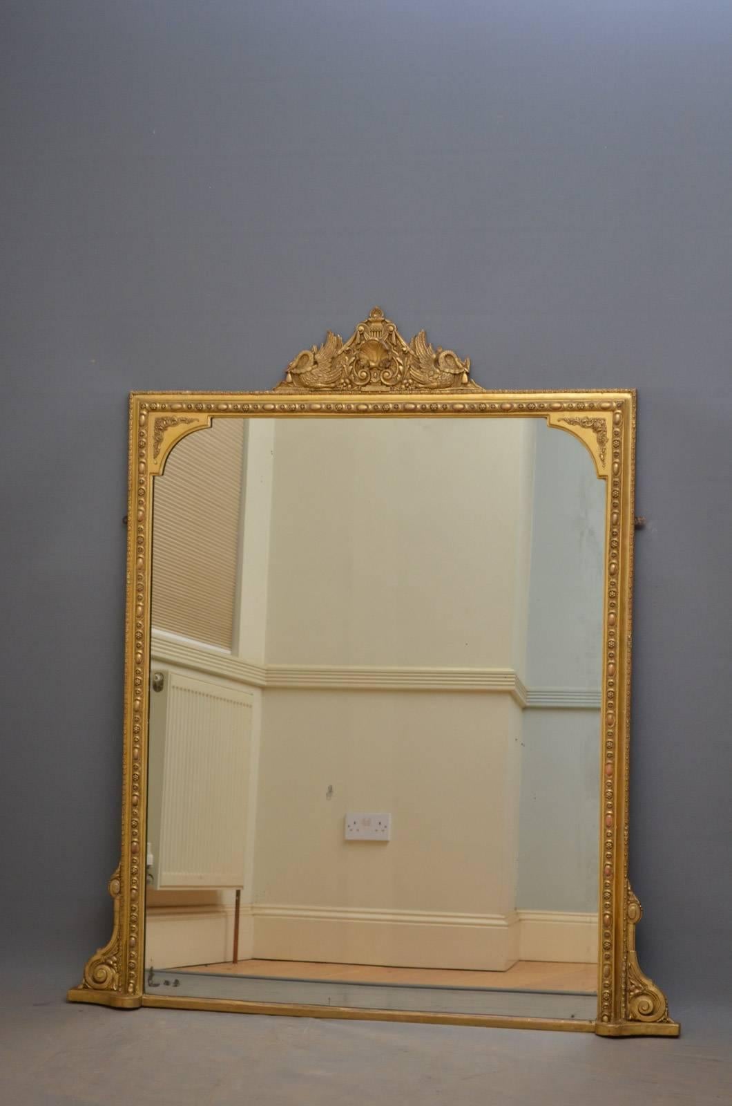 K0315 fine Victorian gilt wall mirror, having attractive cresting to the centre with swans, shell and swags and original mirror plate with foxing in finely decorated frame with scrolls to base. This antique mirror is in excellent original condition
