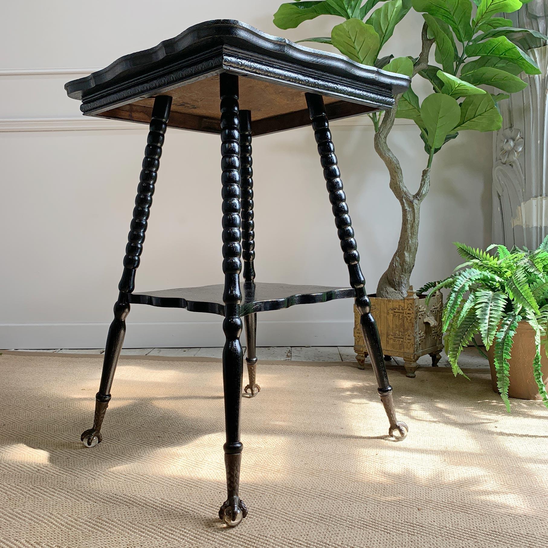 Victorian glass ball and claw ebonised table
C'1870's
Beautiful ebonised side table with turned bobbin legs. There are 4 brass eagle claws holding glass balls for feet, these are original to the table and a fabulous detail. The top of the table has