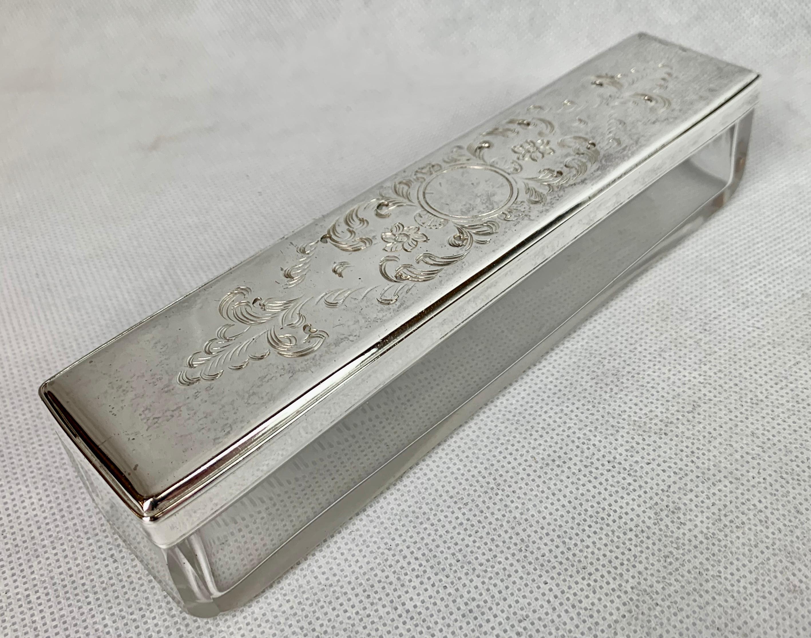 Victorian glass box with a pierced silver plated cover. Originally found in a fitted travel vanity case. The top appears to be hand engraved. This box is in like new condition, so why not use it on your desk for pencils, paper clips, rubber bands.