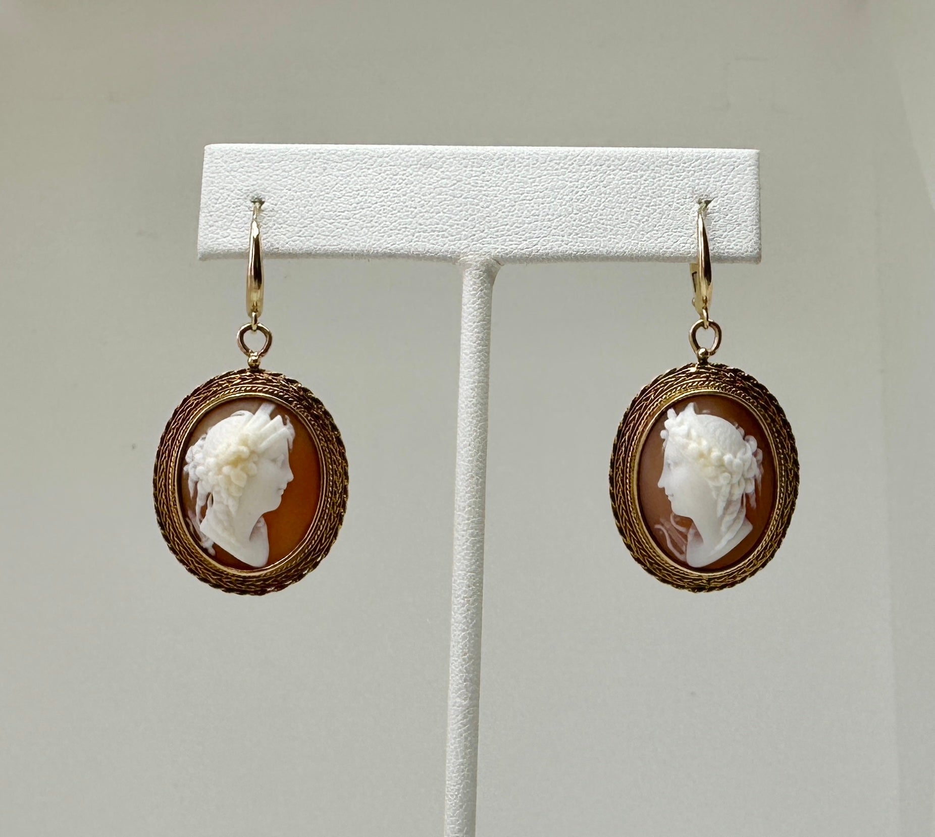 This is a spectacular pair of Antique Victorian Goddess Woman Shell Cameo Pendant Dangle Drop Earrings in 10-14 Karat Gold.   These stunning earrings are of the highest quality.  They have extraordinary hand carved Cameos of two Goddesses.  The two
