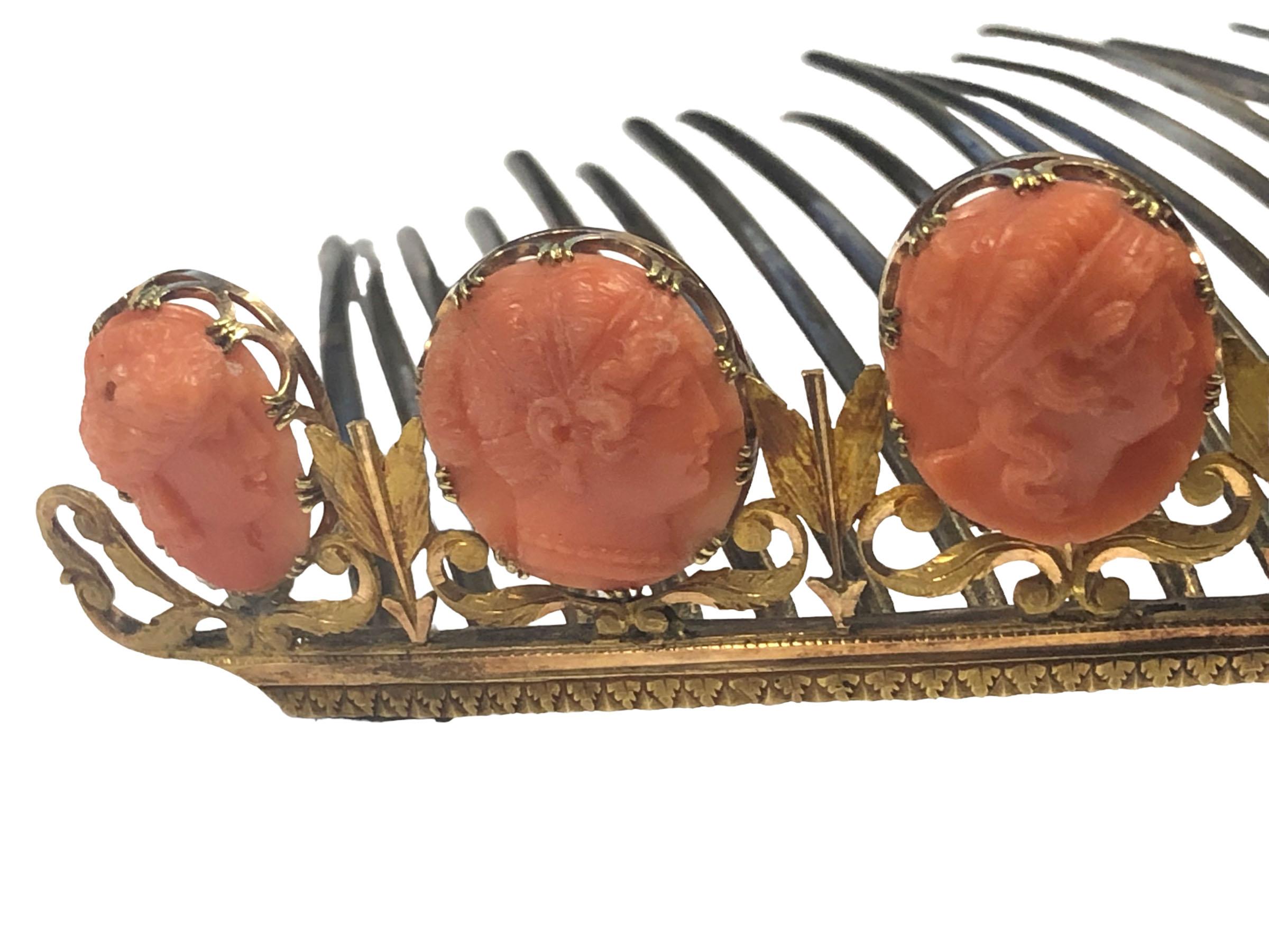 Circa 1860 - 1880 Tiara, measuring 5 1/2 inches across and 1 1/8 inches in height, Hand Chased 18k Yellow Gold front set with Carved Coral Cameos of various depictions. Gold tines measuring 2 3/4 inches long, having several undetermined European