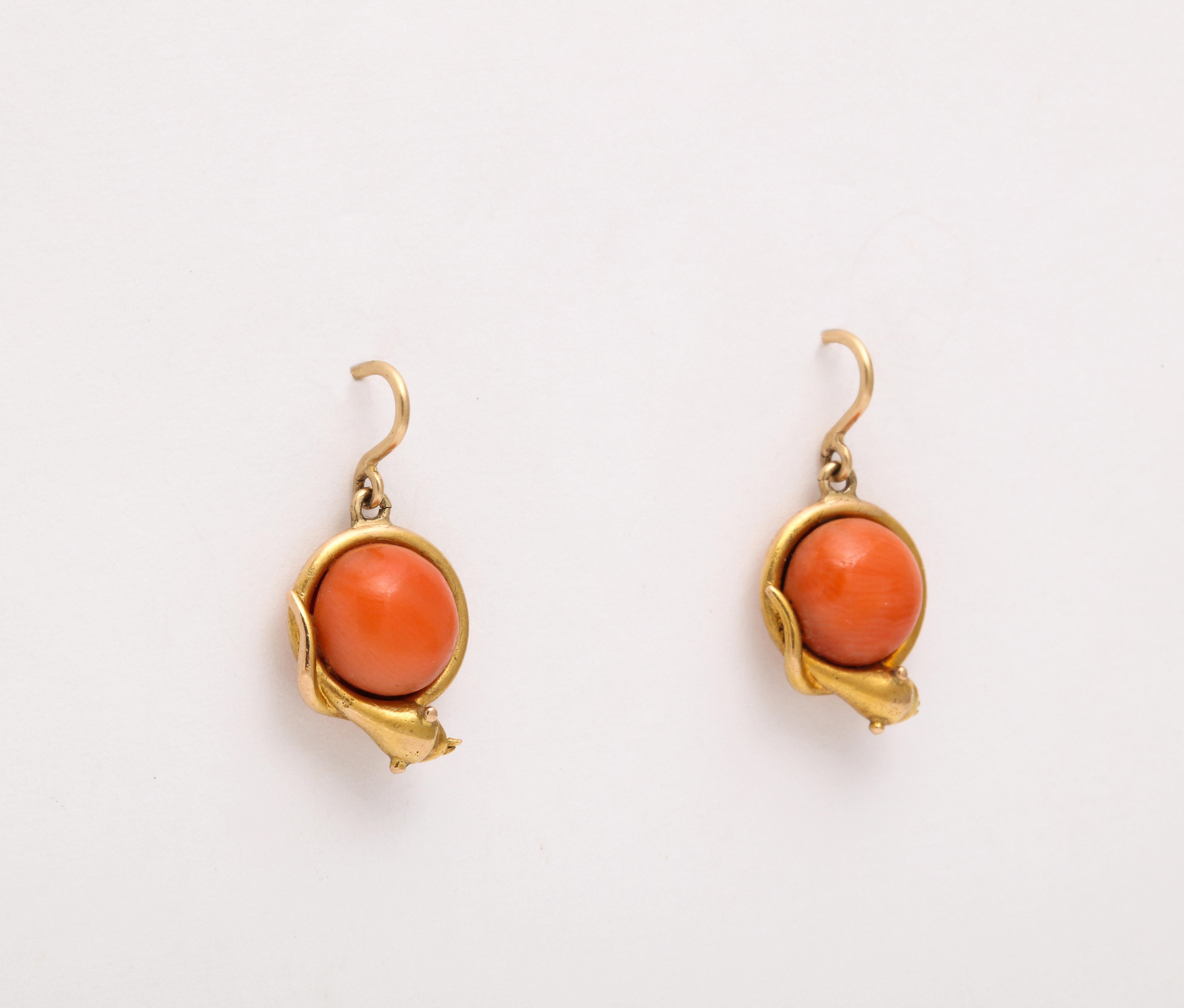 When little ear drops with an orb of color suit your day, here are 14 Kt gold Victorian natural coral earrings cuddled with in a serpent frame. Serpents have been symbolic throughout history. In the Georgian and Victorian periods snakes with their