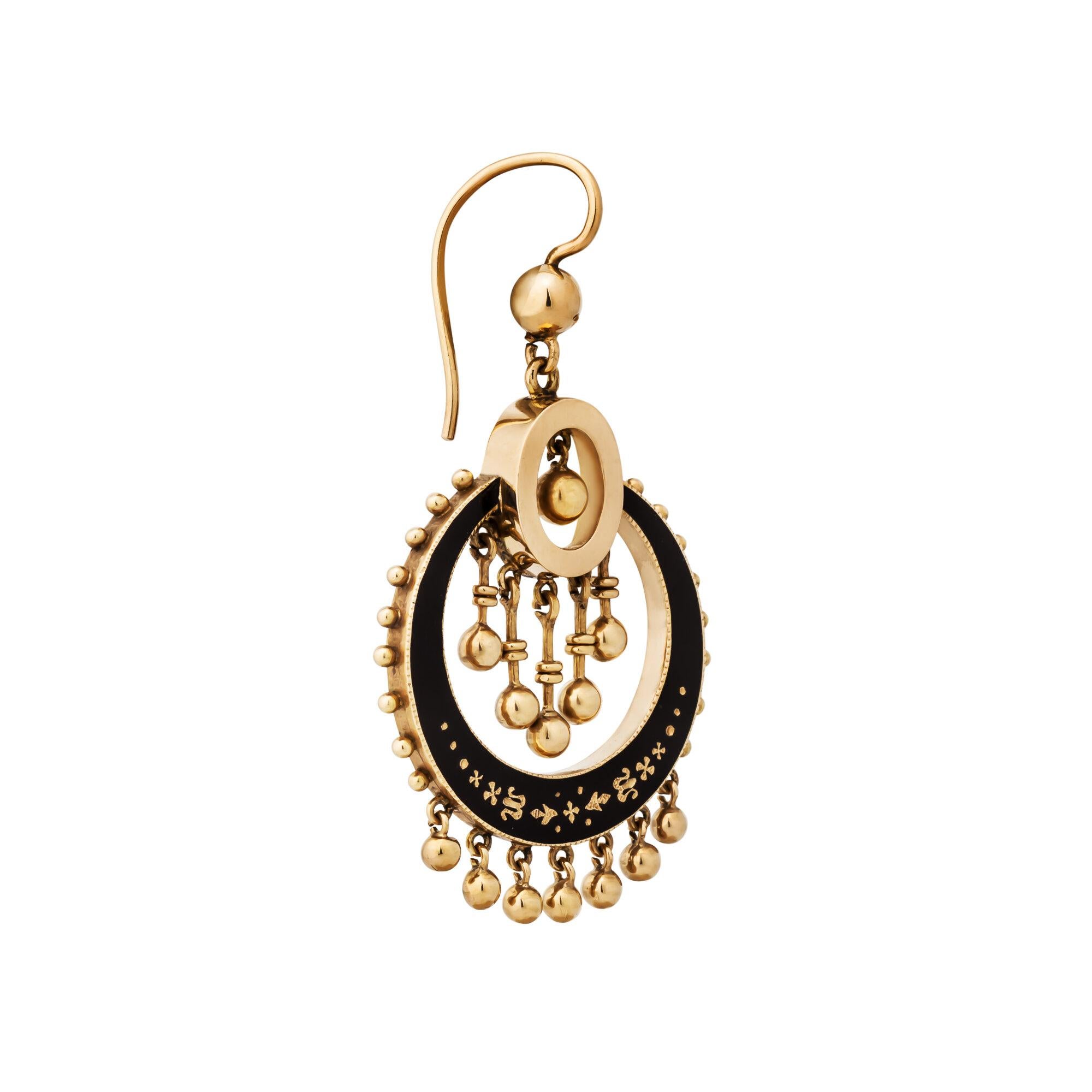 These Victorian gold and black enamel drop handmade earrings will dance 24/7 on anyone's ears.  With a series of hanging spheres that move gracefully, these circular two dimensional drop earrings will never stand still.  Circa 1875-1890.  14 karat