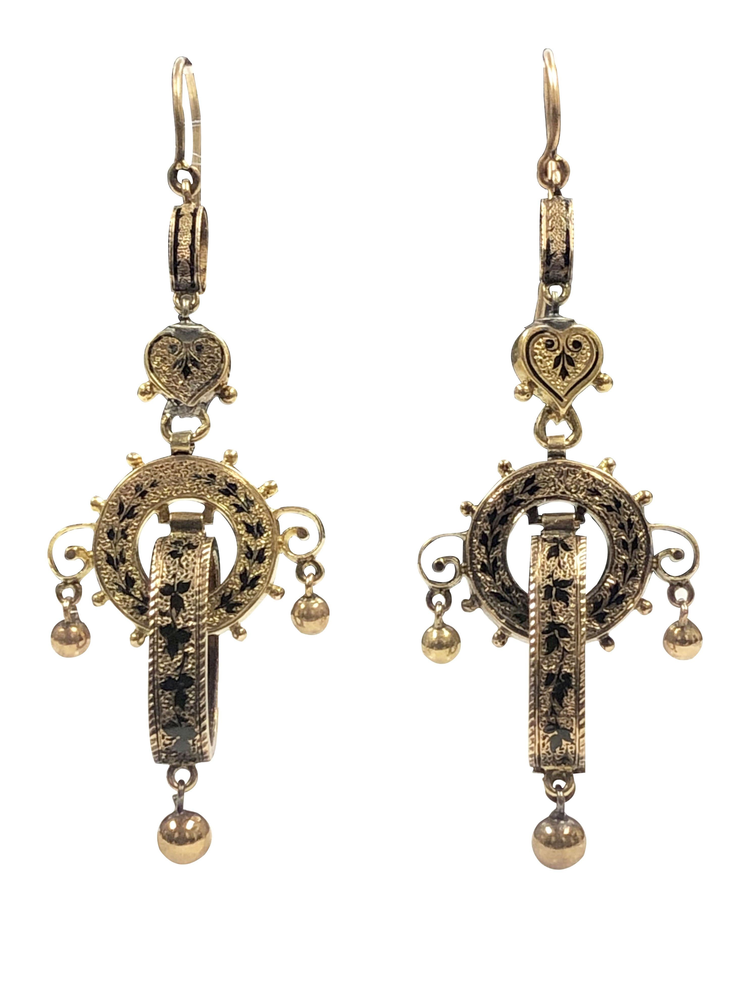 Circa 1870 High Style Victorian 14K Yellow Gold Dangle Earrings, measuring 2 1/2 inches in Length and 7/8 inch wide. comprised of several individual sections each are articulated with lots of movement. Finished with Black Enamel and in near